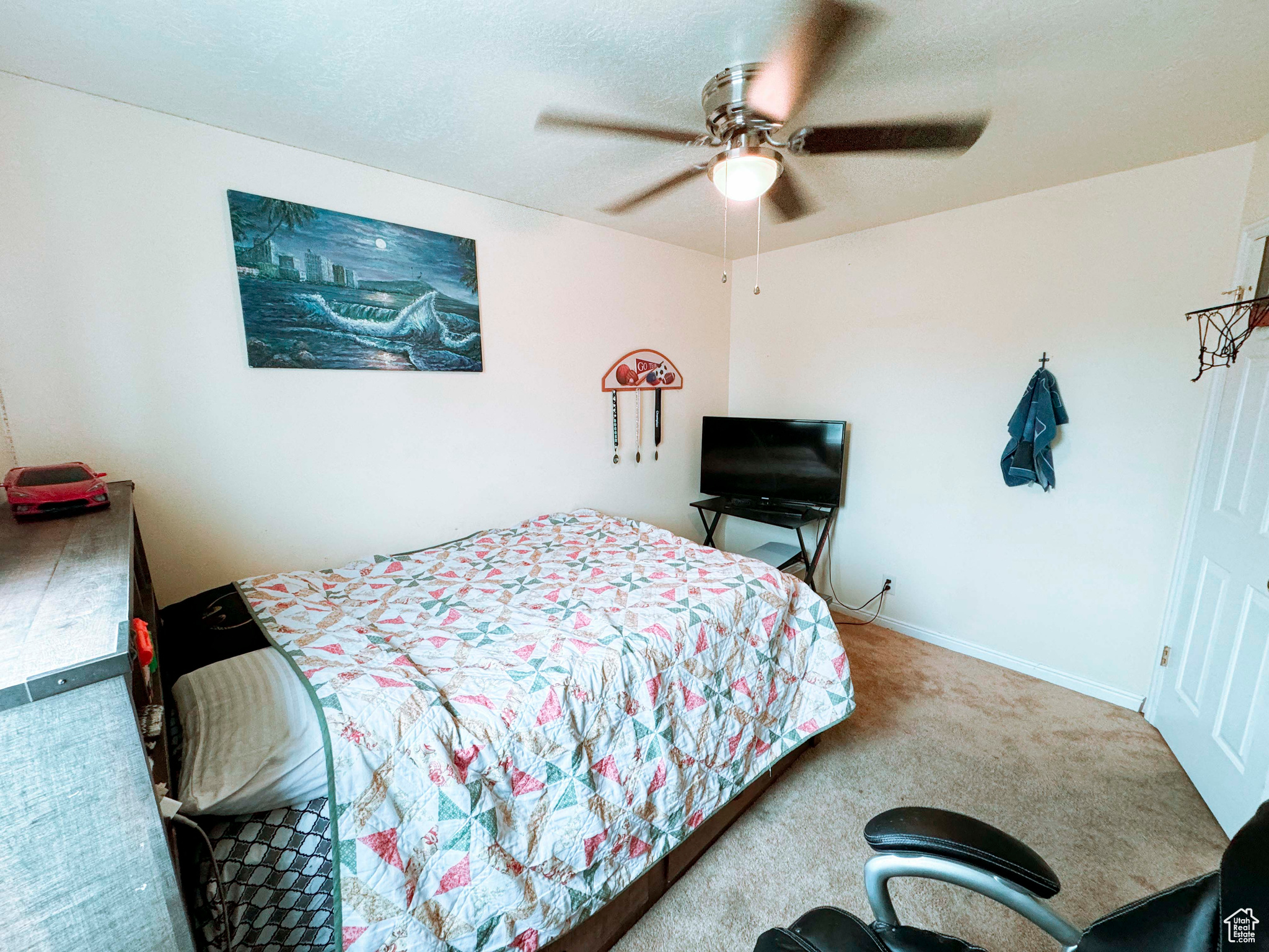 Bedroom with ceiling fan and carpet flooring