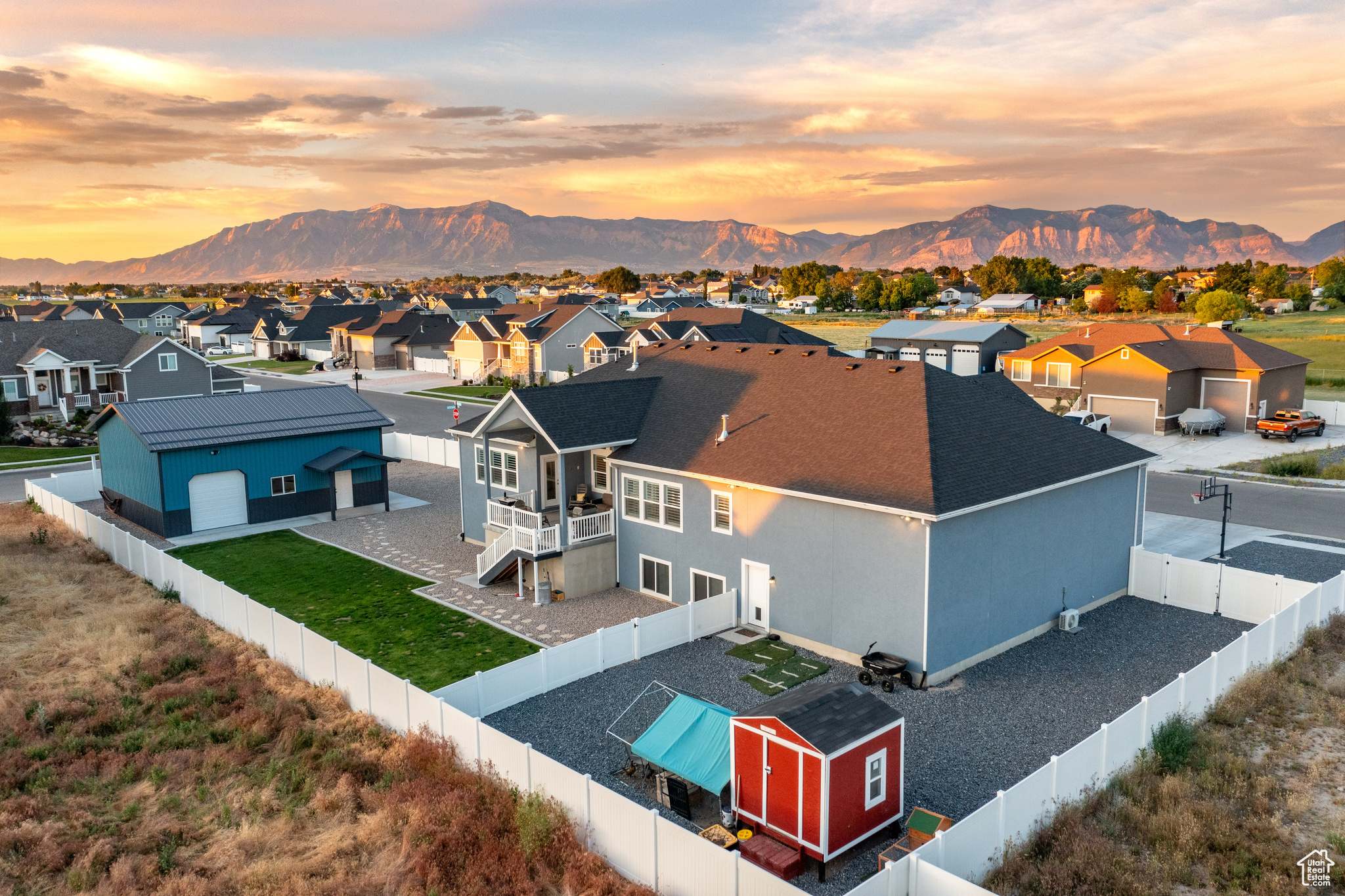 Aerial view at dusk featuring a mountain view