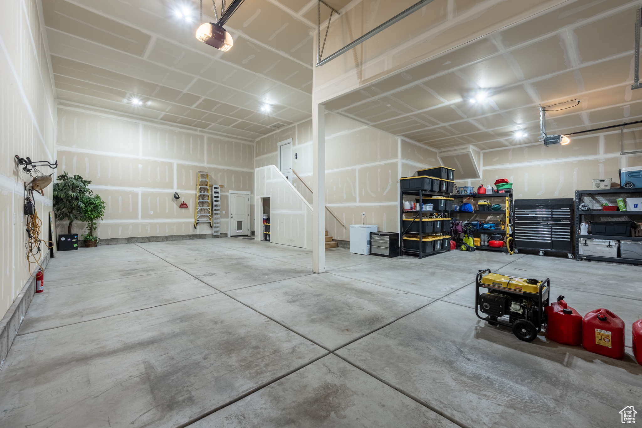 Garage featuring a garage door opener