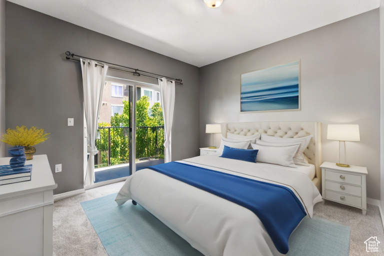 Carpeted bedroom featuring access to outside and multiple windows