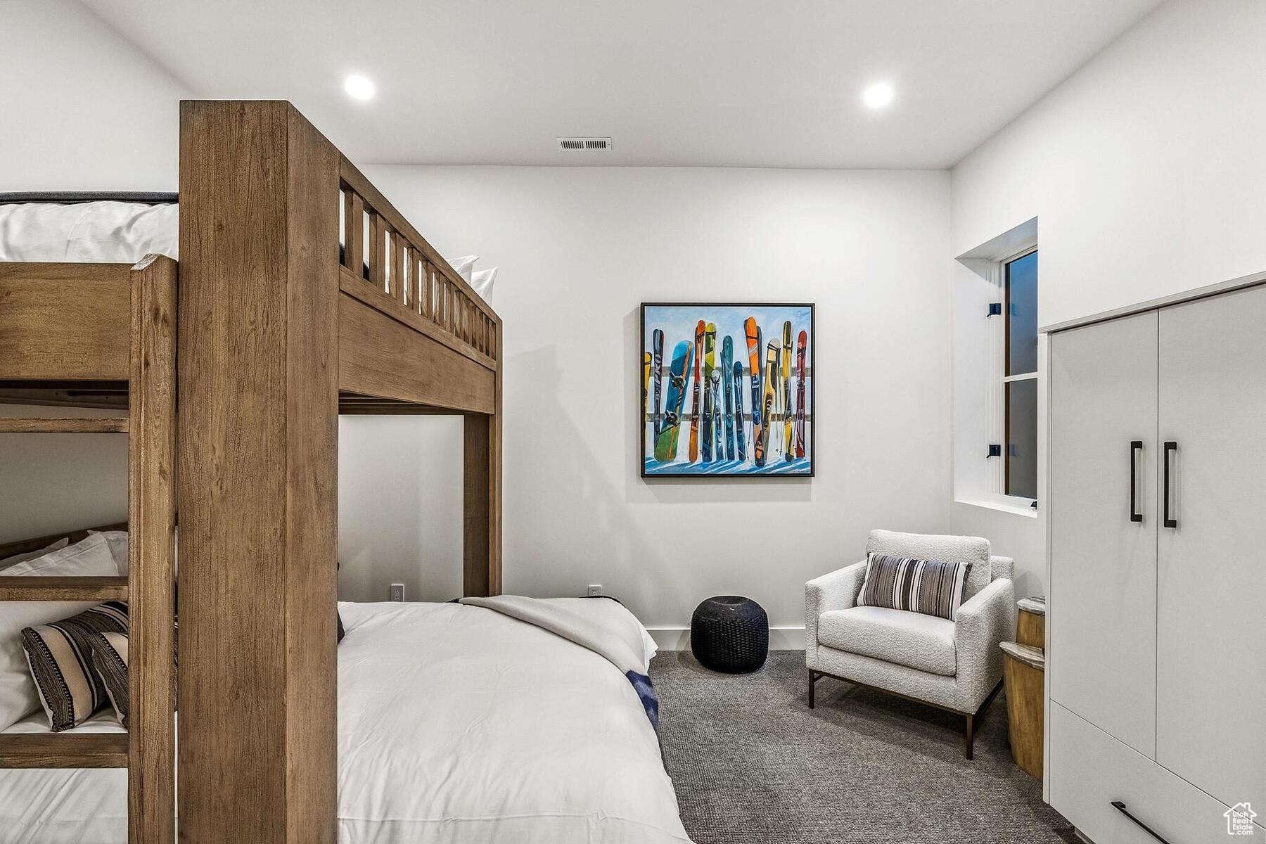 Bedroom with a closet and carpet flooring