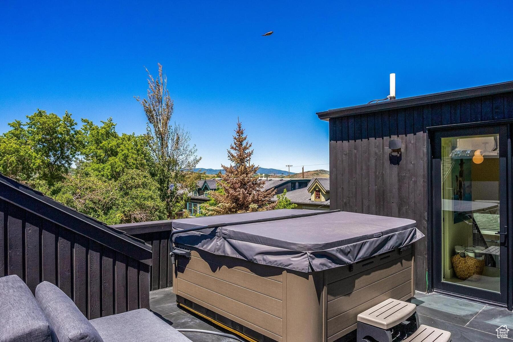 Deck featuring a hot tub