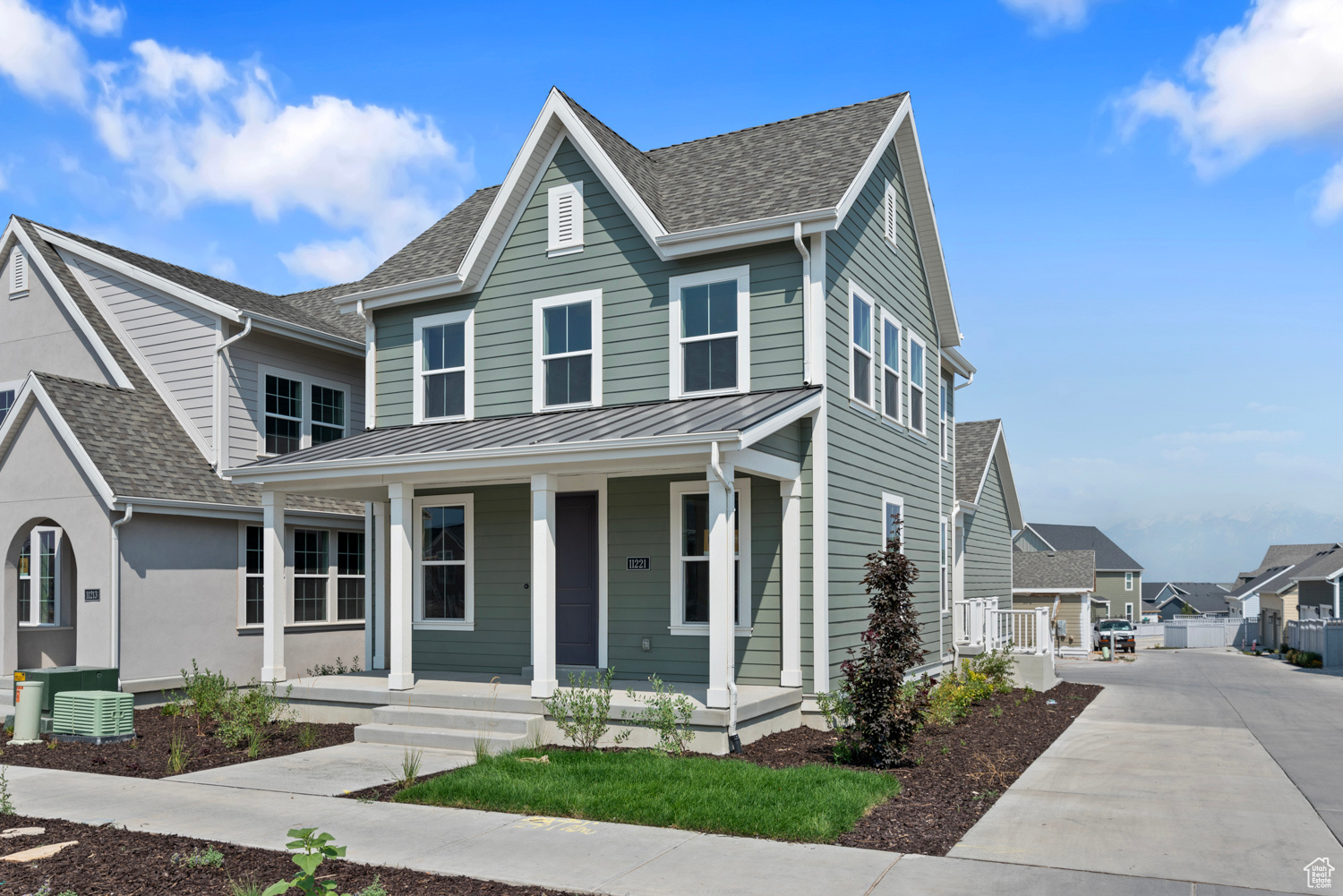 View of front of home featuring central air condition unit and covered porch