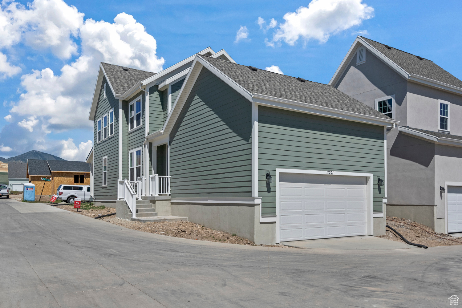 View of property exterior with a garage