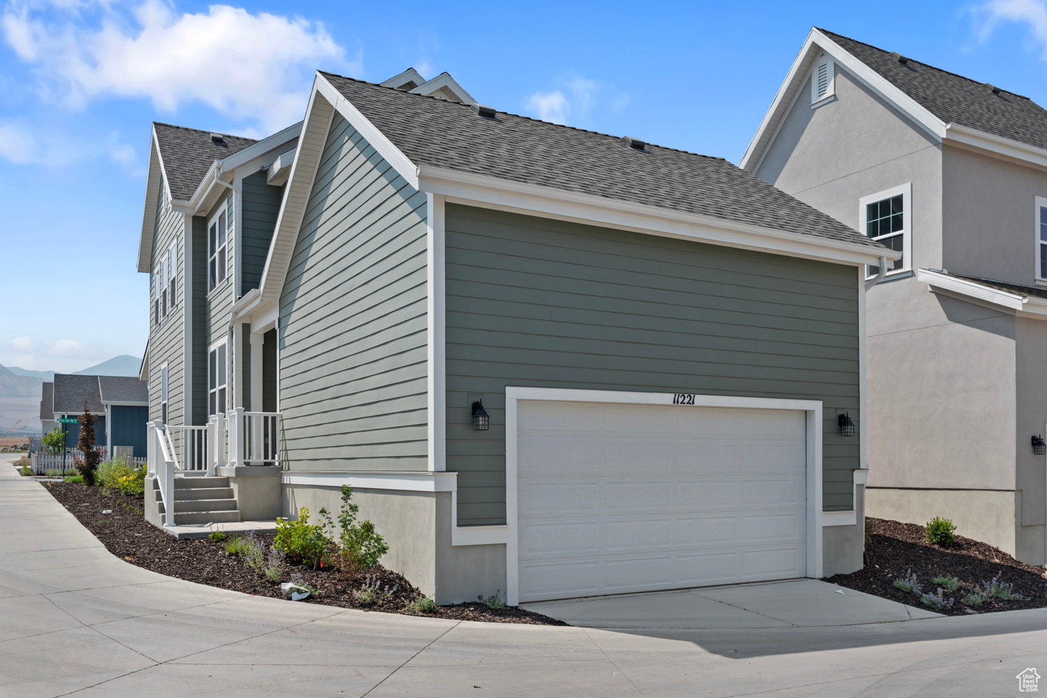 View of side of home with a garage