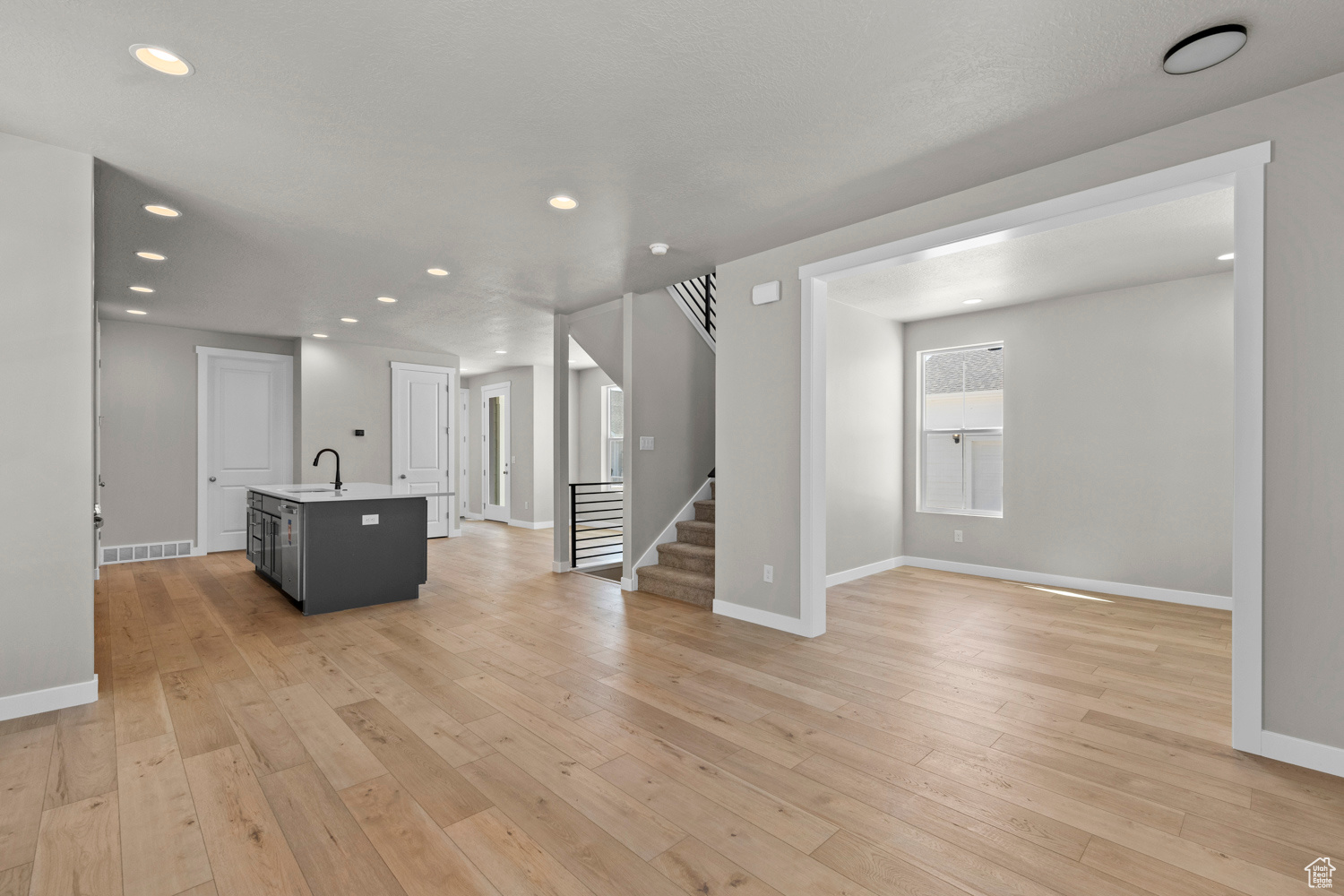 Interior space with light hardwood / wood-style floors and sink