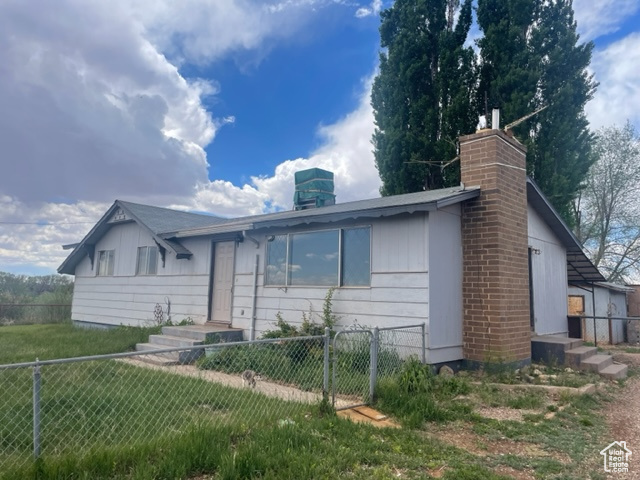 View of front of property with a front yard