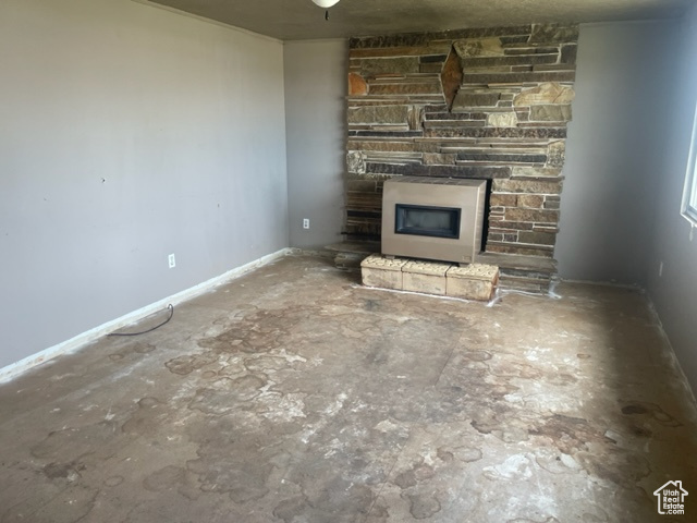 Unfurnished living room featuring a fireplace