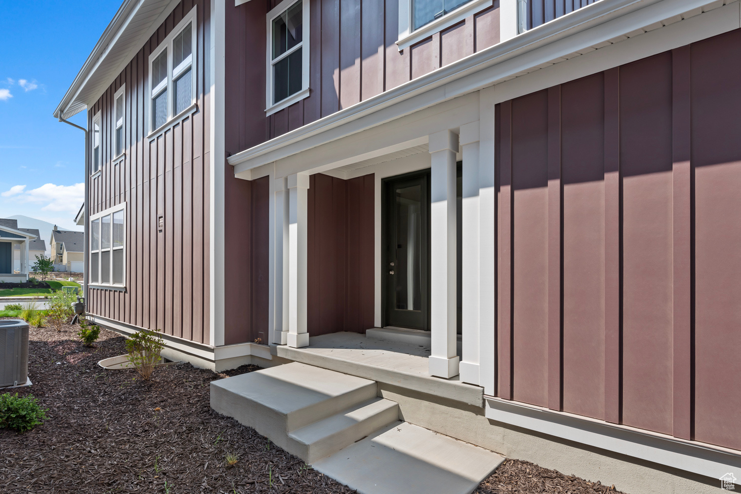 Doorway to property featuring central AC