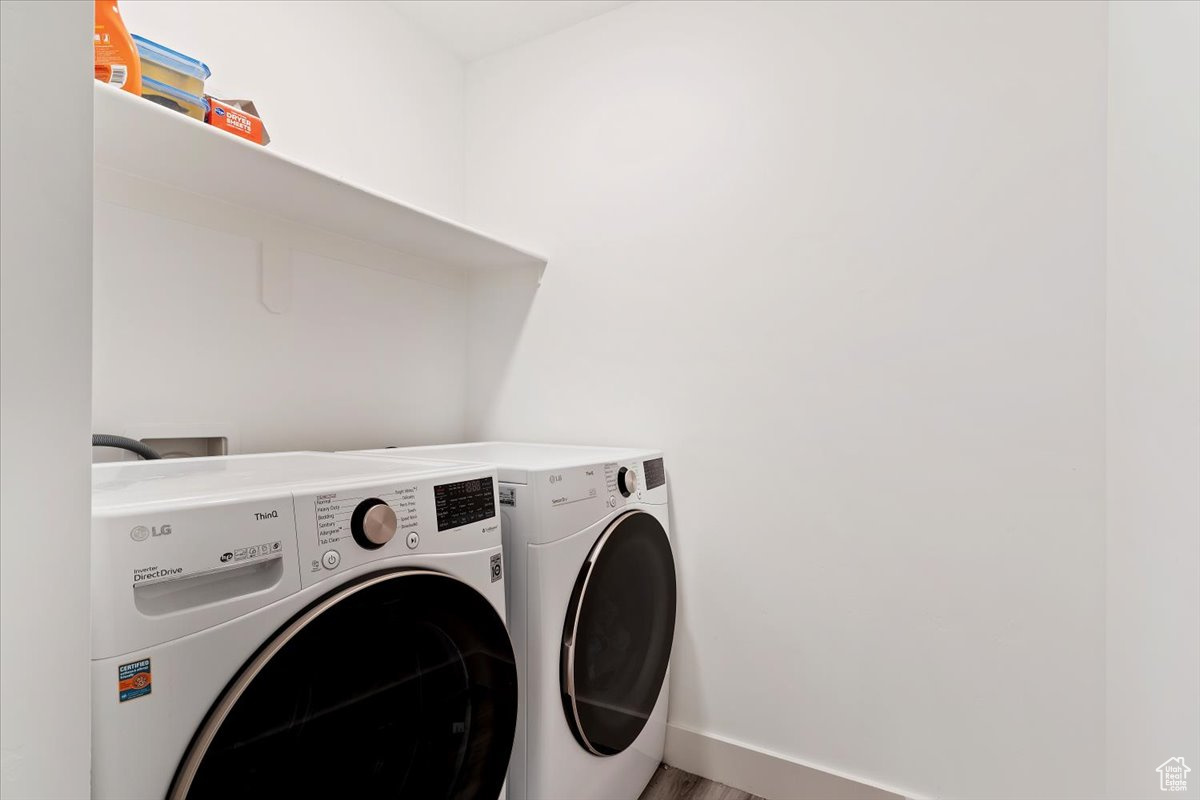 Laundry area with separate washer and dryer and hookup for a washing machine