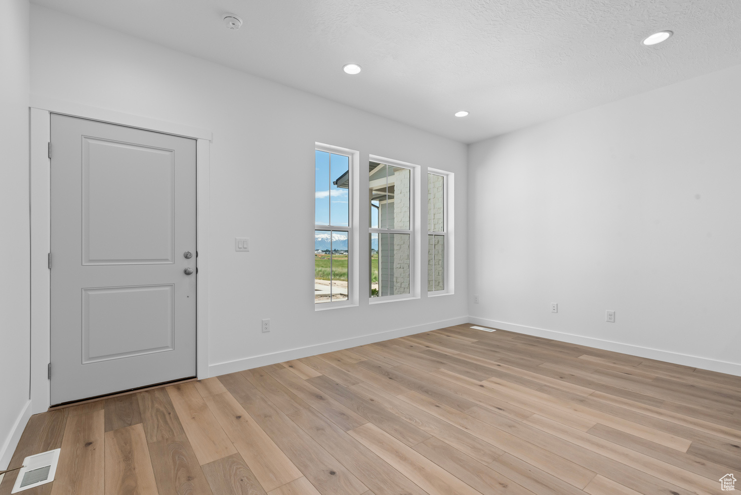 Empty room featuring light hardwood / wood-style floors