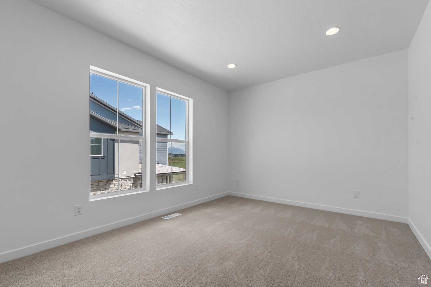 View of carpeted spare room