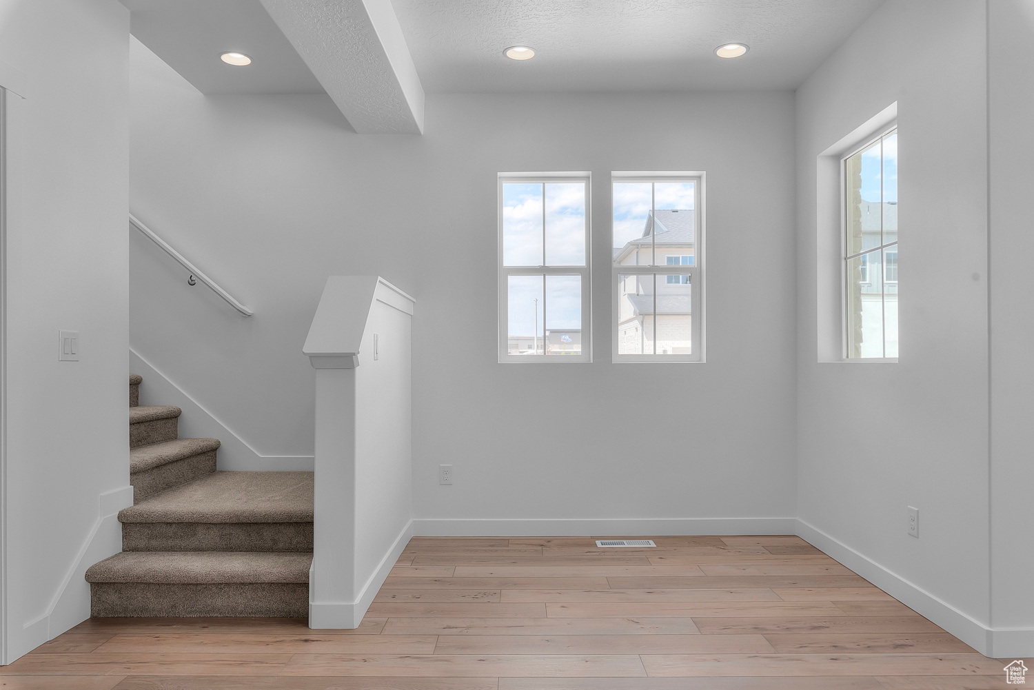 Stairway with light wood-type flooring