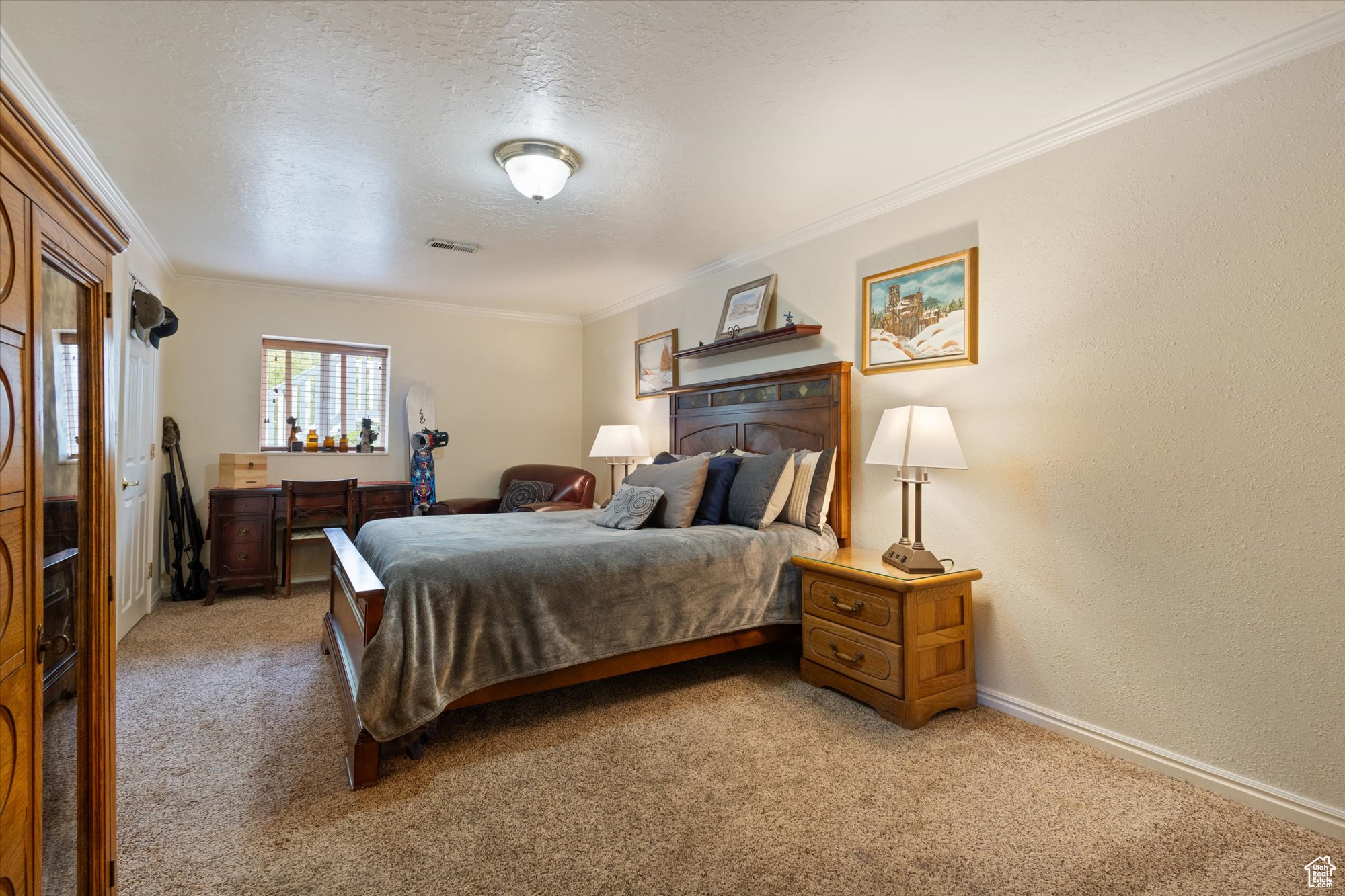 Carpeted bedroom with walk-in closet