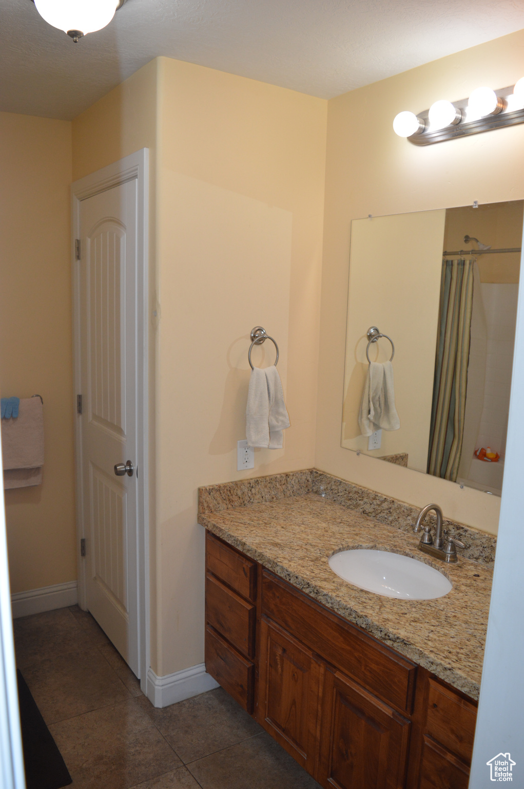 Bathroom with tile floors and vanity