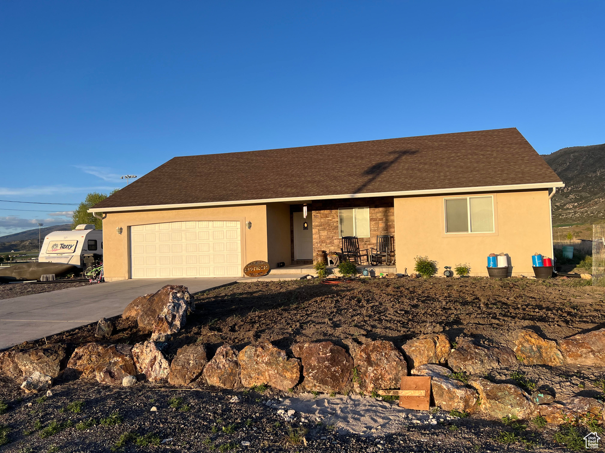 Ranch-style home featuring a garage