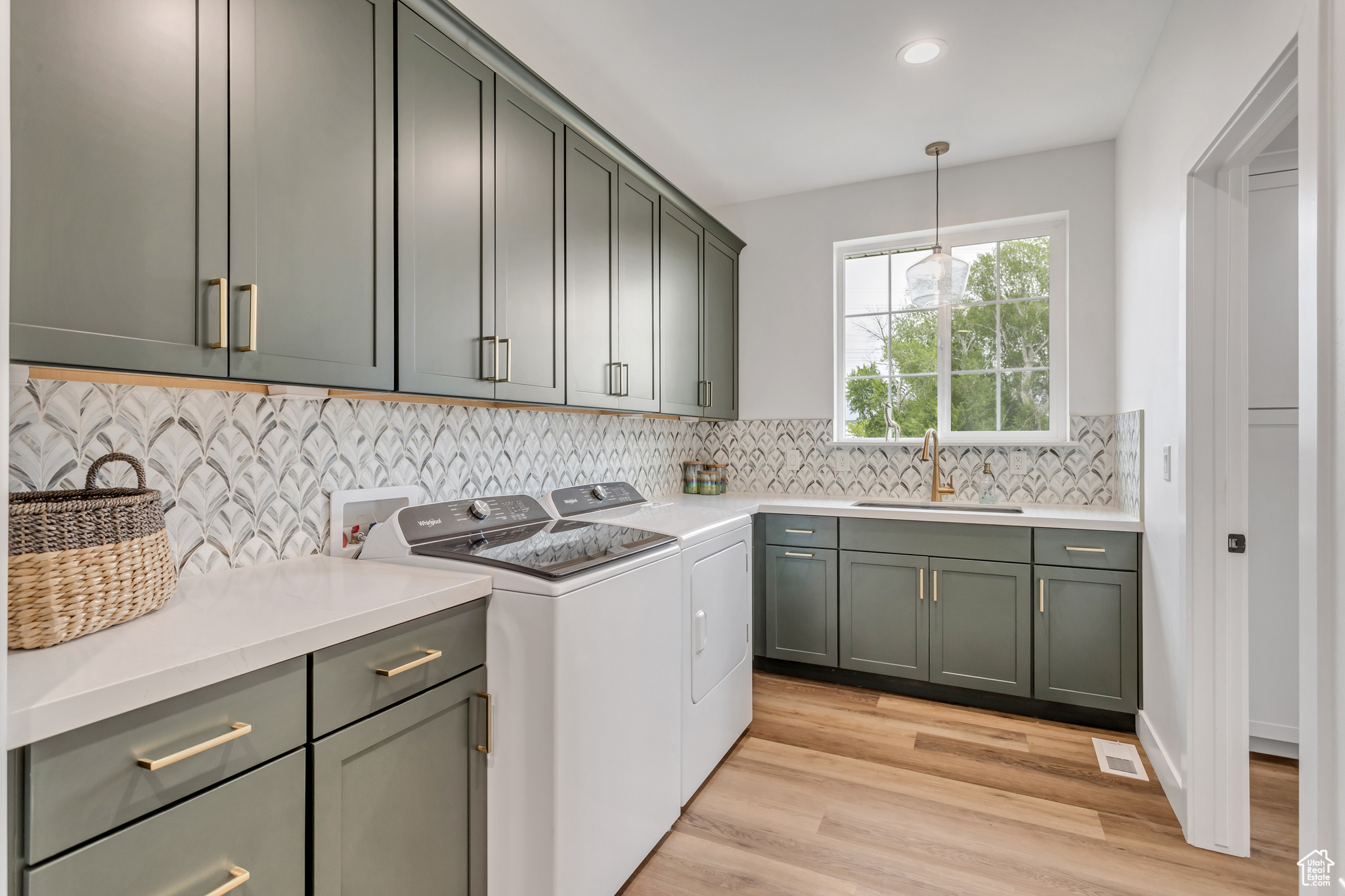 Washroom featuring abundant cabinets, under cabinet electrical outles & sink