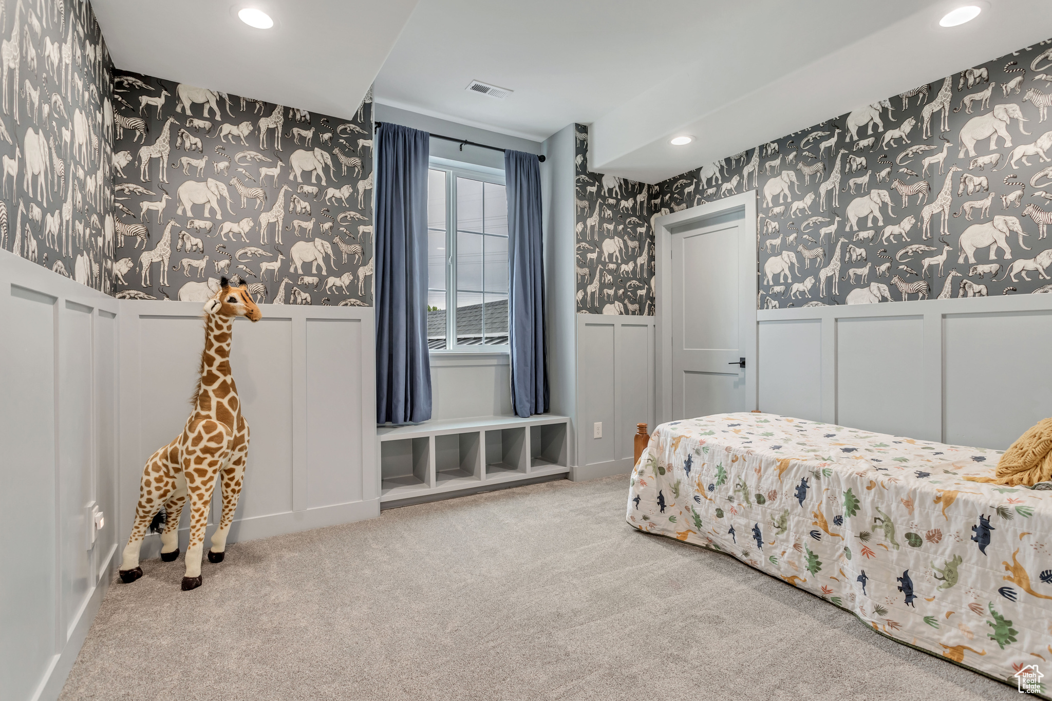 Upstairs carpeted bedroom with window seat & walk-in closet