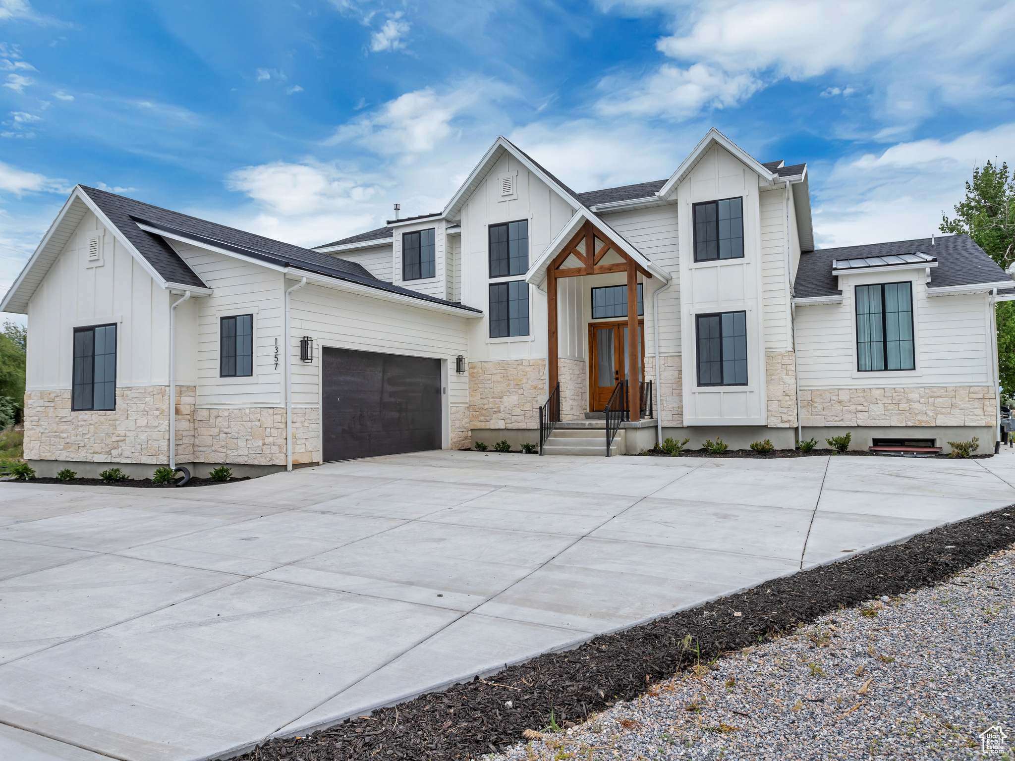 View of front facade featuring a garage