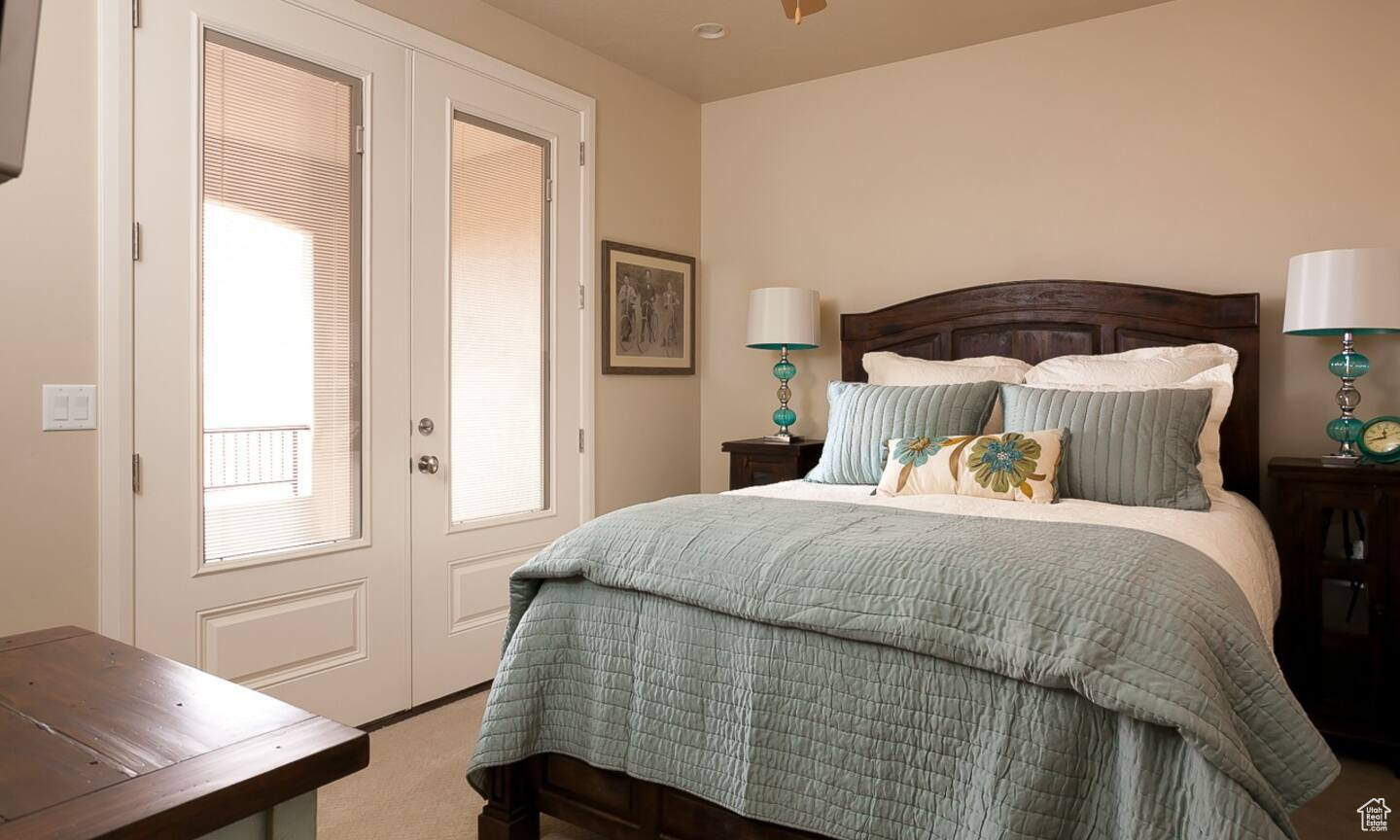 Bedroom with carpet and french doors