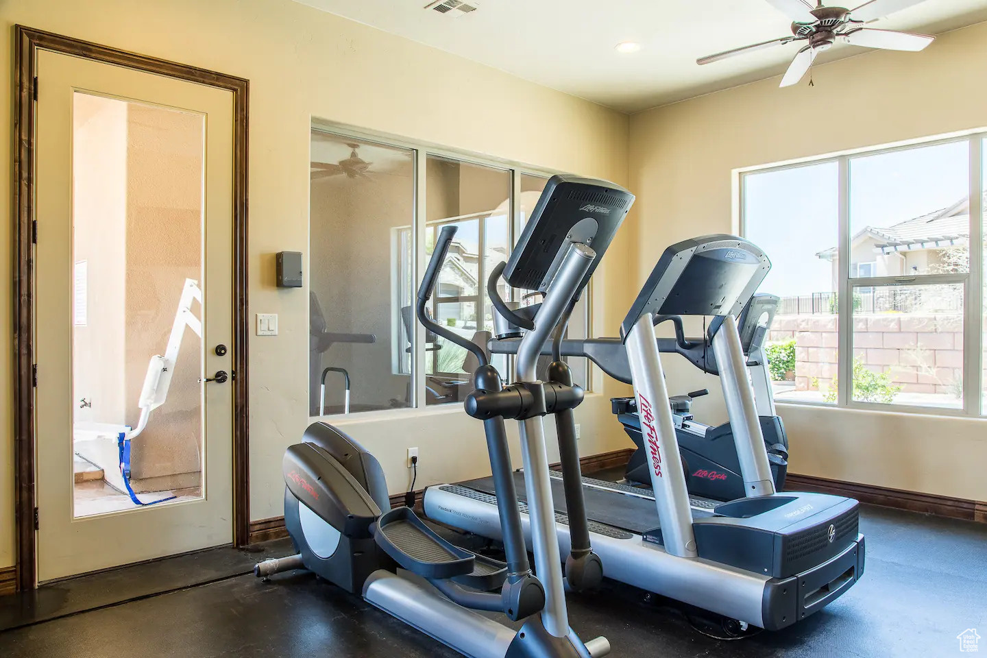 Exercise room with ceiling fan