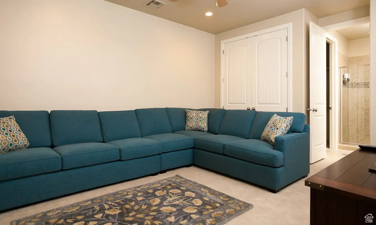 Living room featuring ceiling fan