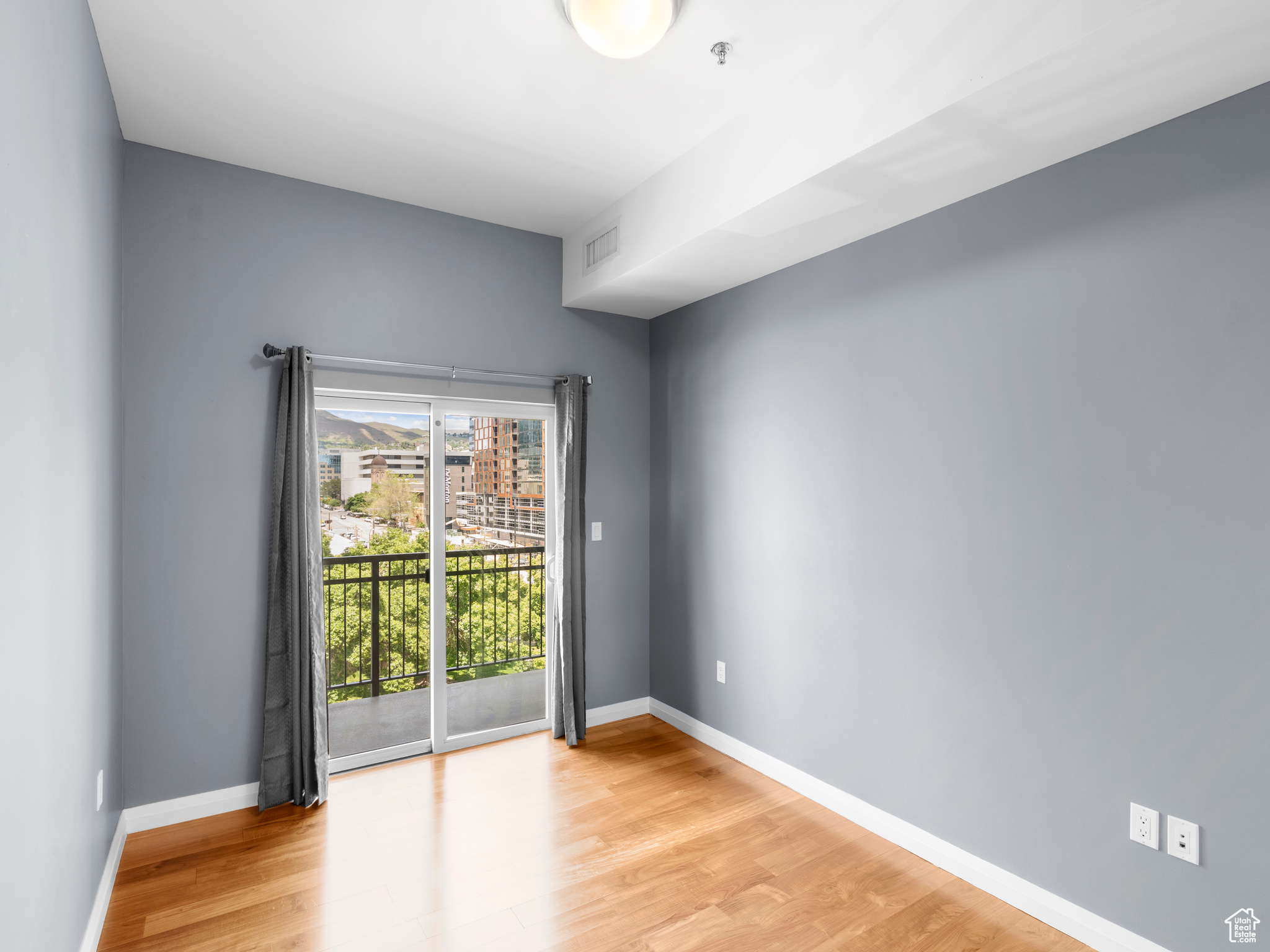 Spare room with light hardwood / wood-style floors