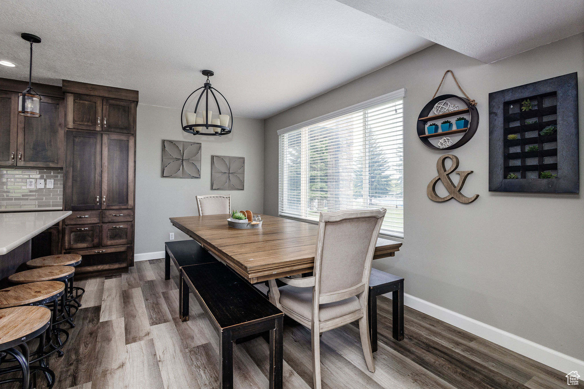 Dining area with a chandelier and hardwood / wood-style floors