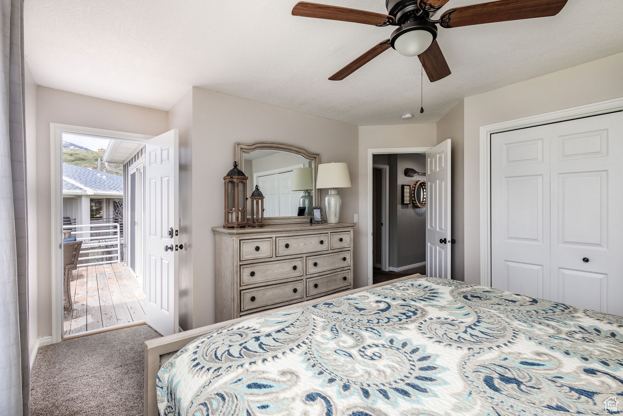 Bedroom featuring carpet flooring, a closet, and ceiling fan