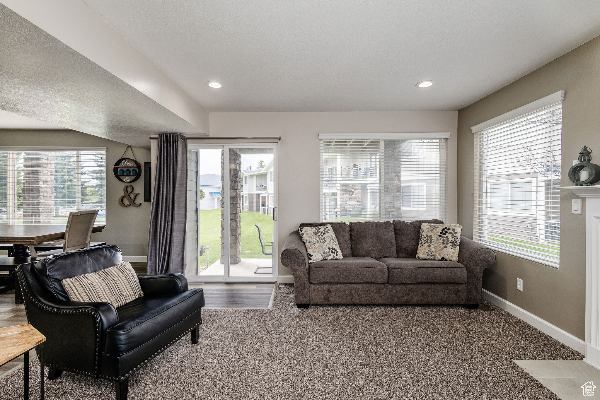 Living room with carpet flooring and plenty of natural light