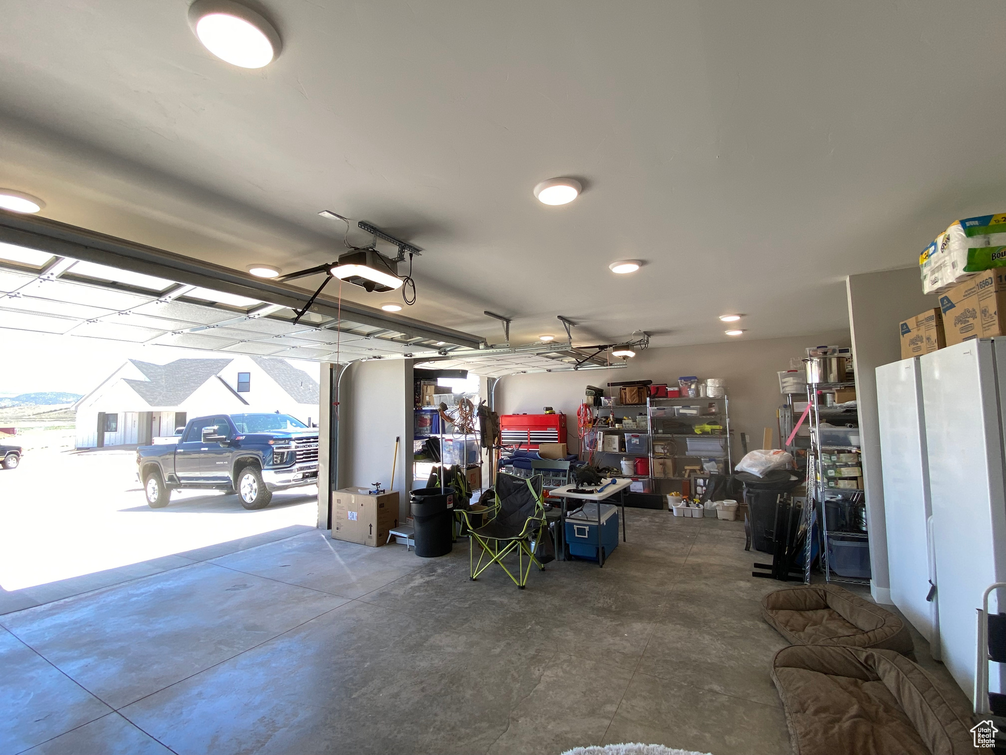 Garage featuring a garage door opener