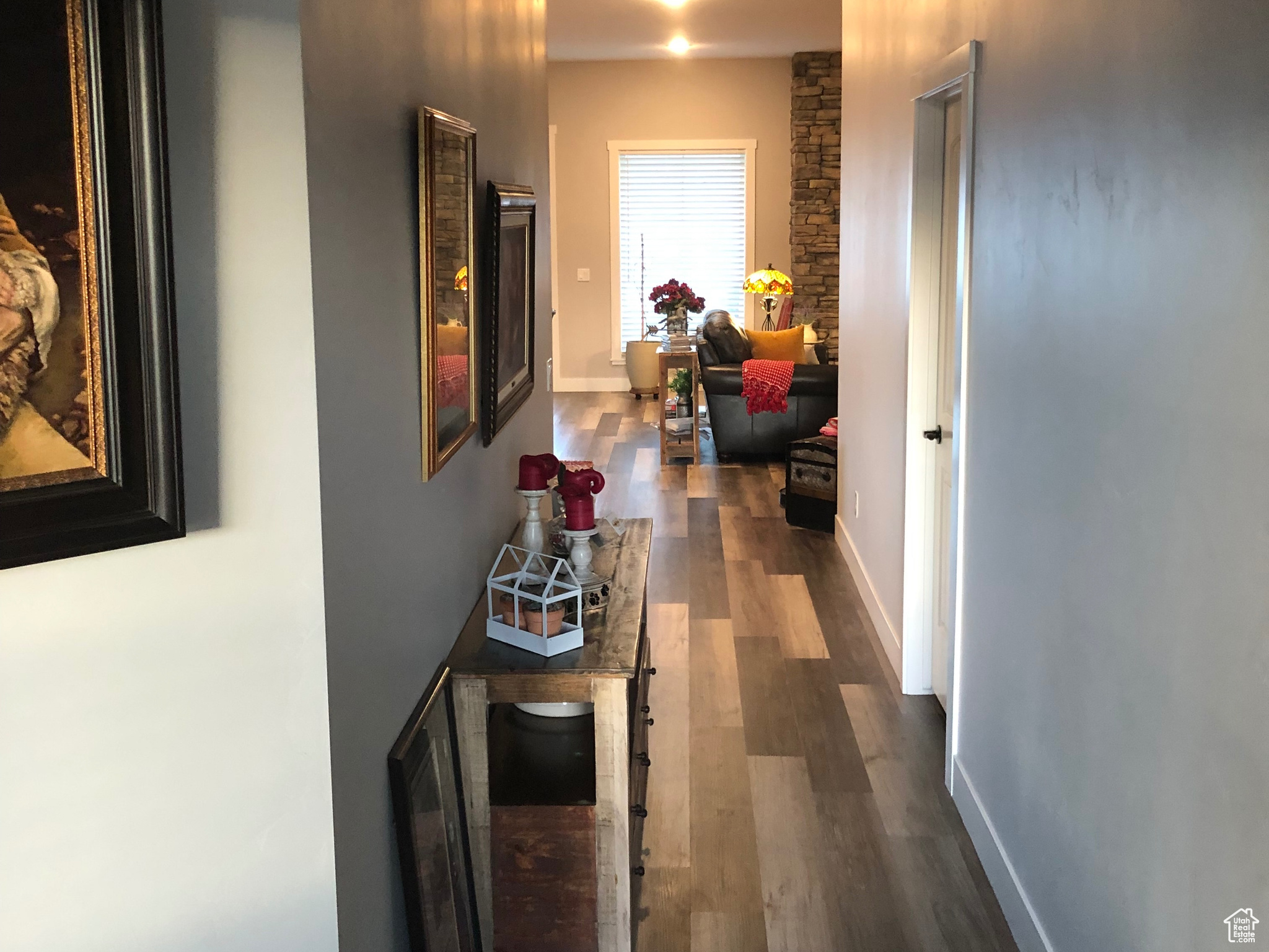 Corridor with dark hardwood / wood-style floors