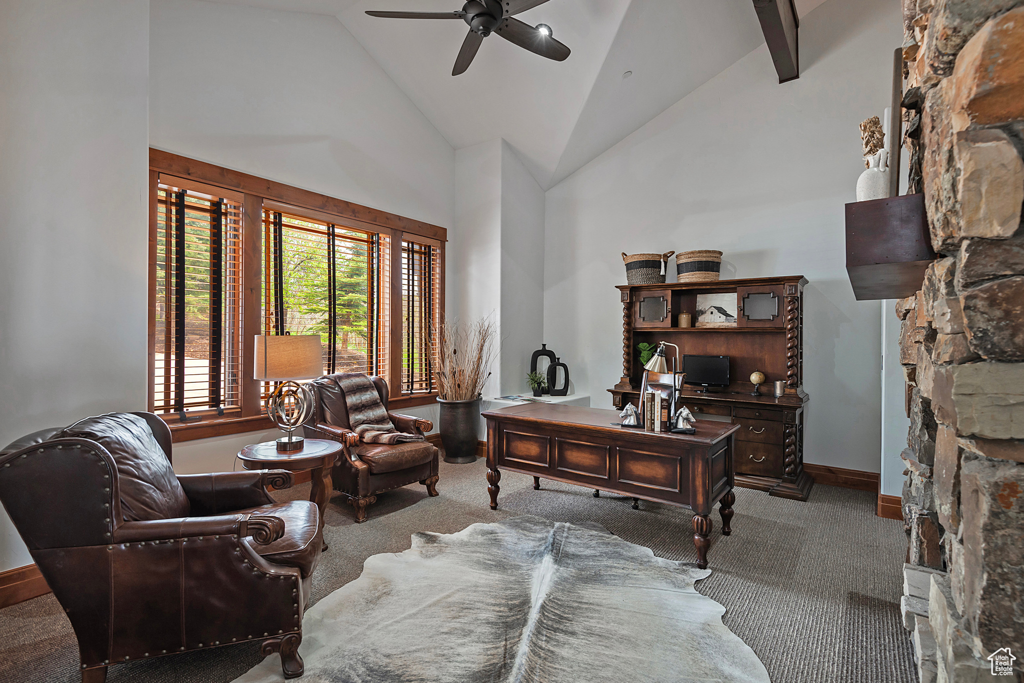 Office on the Main Level featuring high vaulted ceiling and a Fireplace