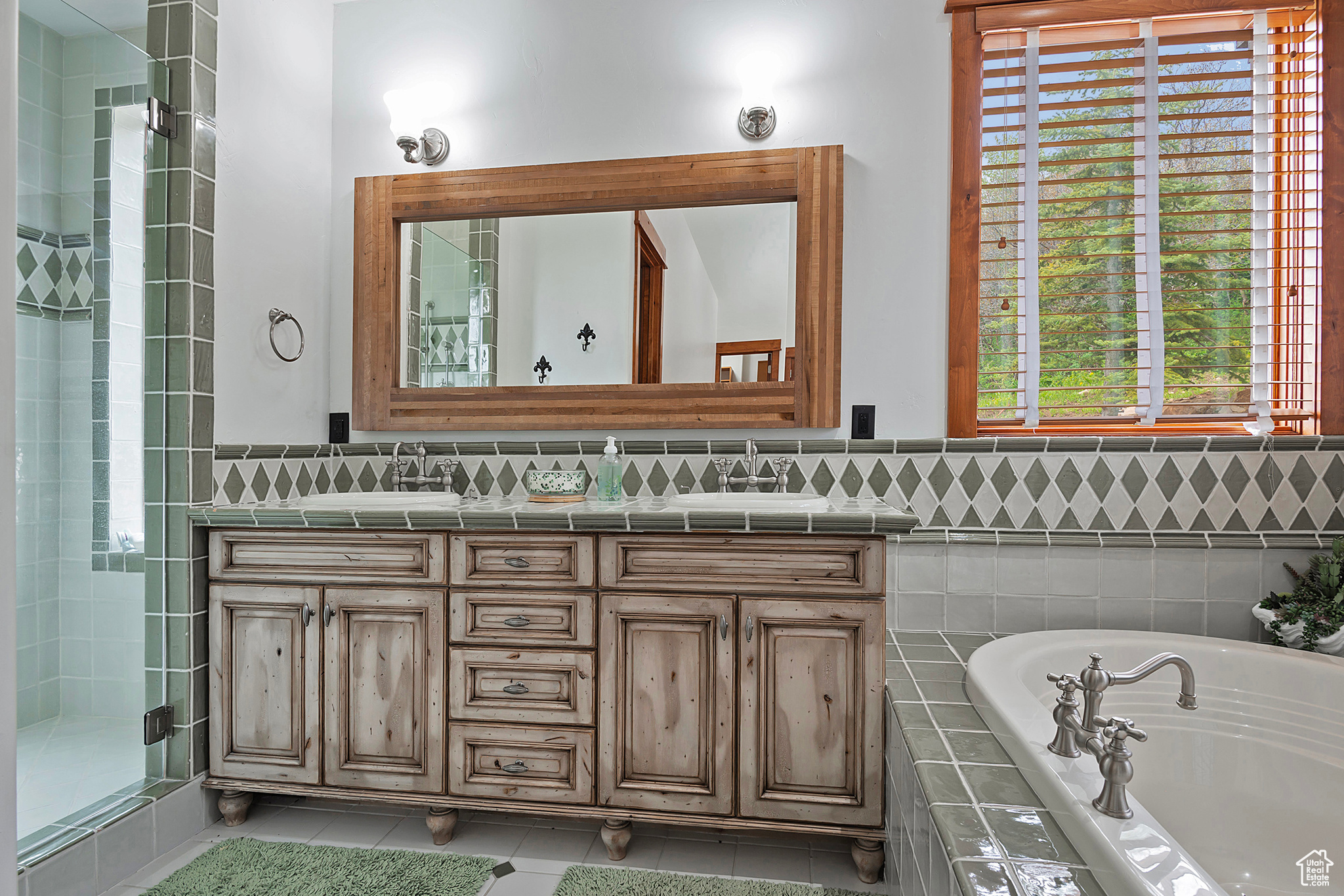 2nd Bedroom Suite Bathroom with tile floors, a healthy amount of sunlight, large vanity, and double sink