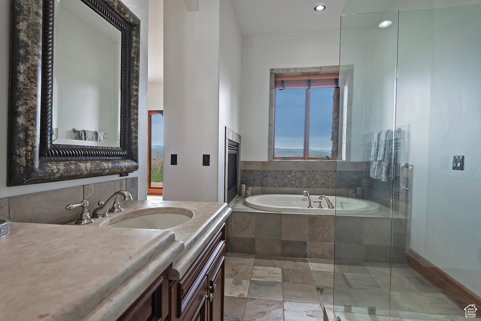 3rd Primary Suite Bath featuring vanity with extensive cabinet space, independent shower and bath, and tile floors