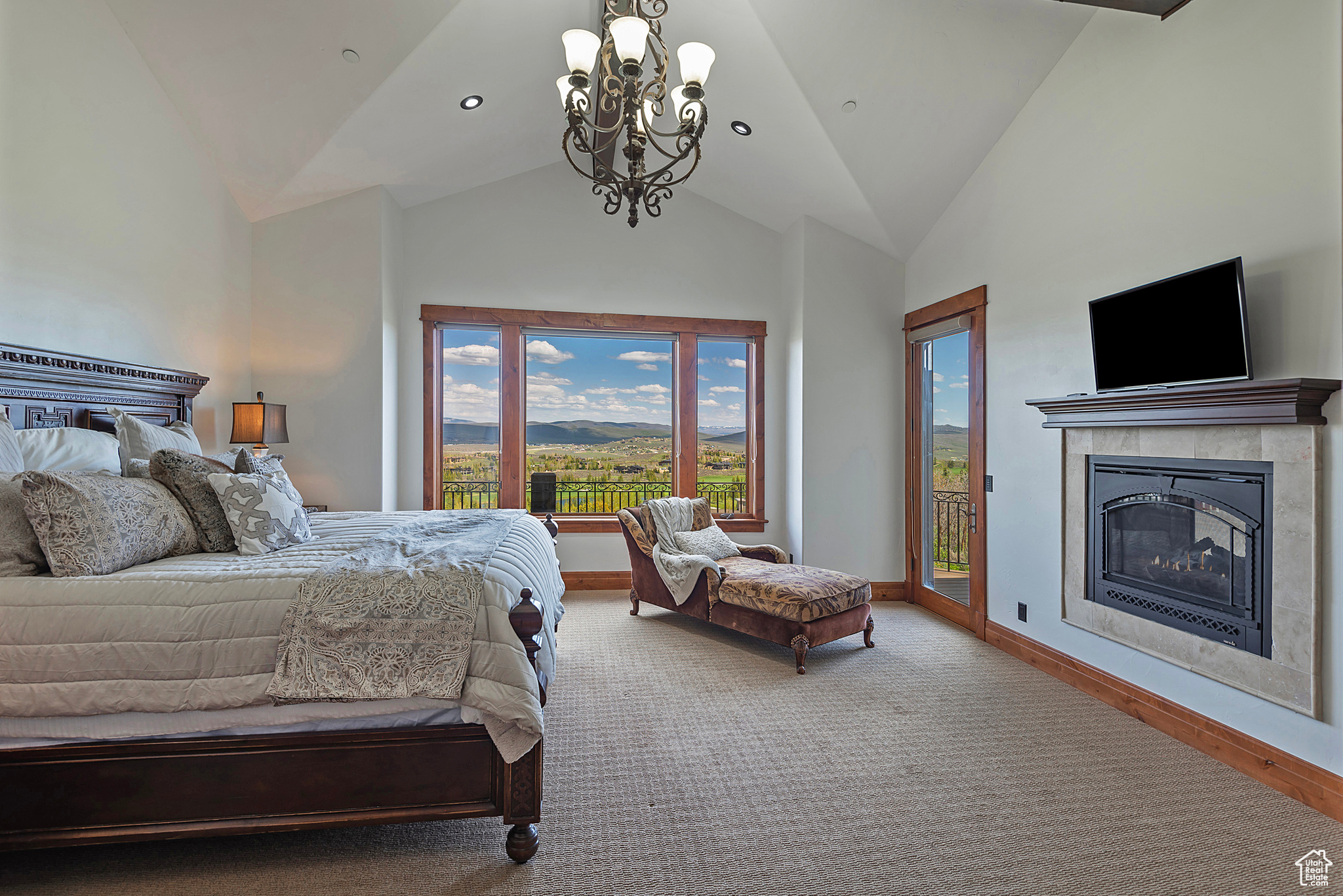 Primary Bedroom on the Main Level with a Fireplace and Deck Access to Enjoy the Beautiful Views