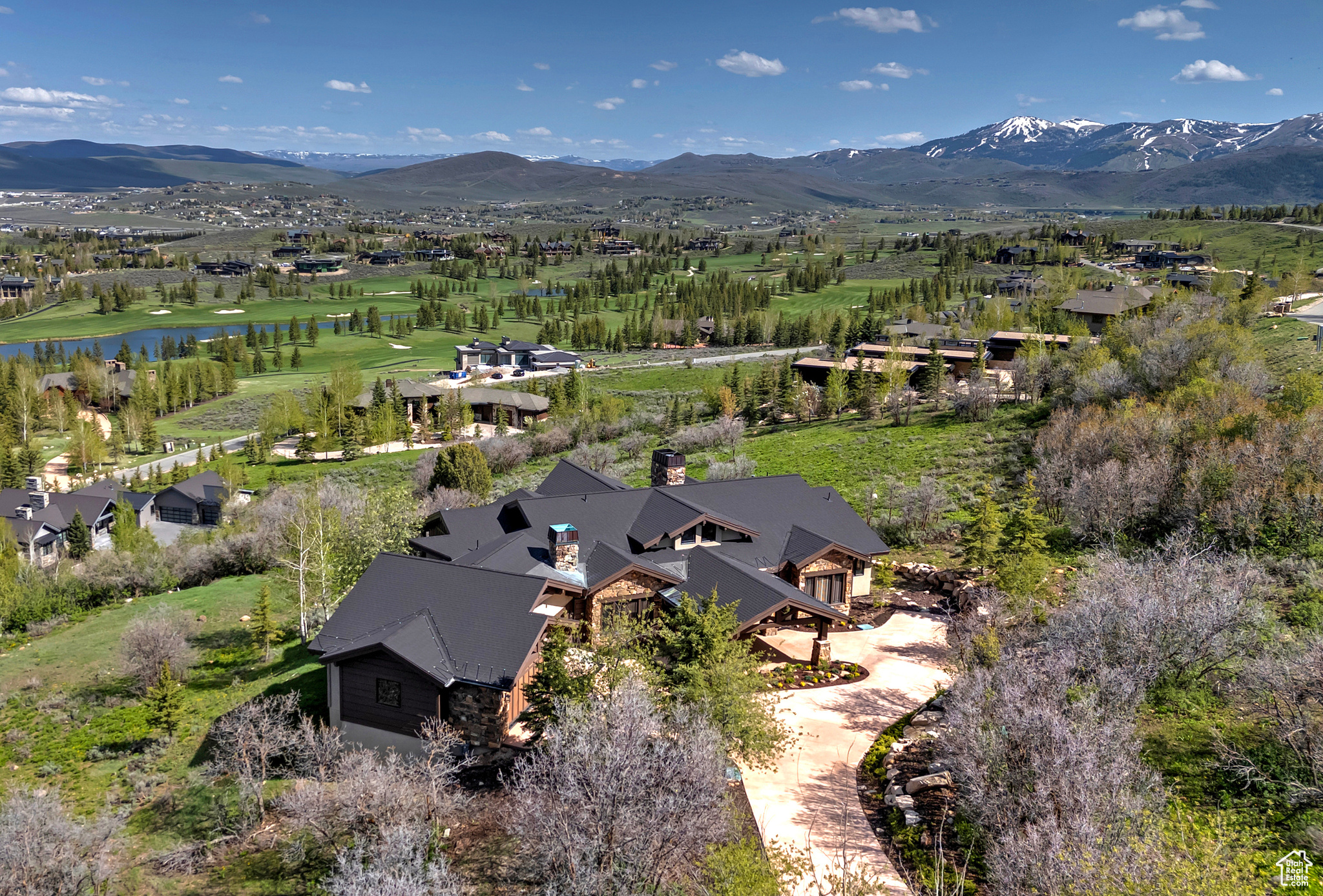 Bird's eye view of the Golf Course, Pond & Mountains Beyond