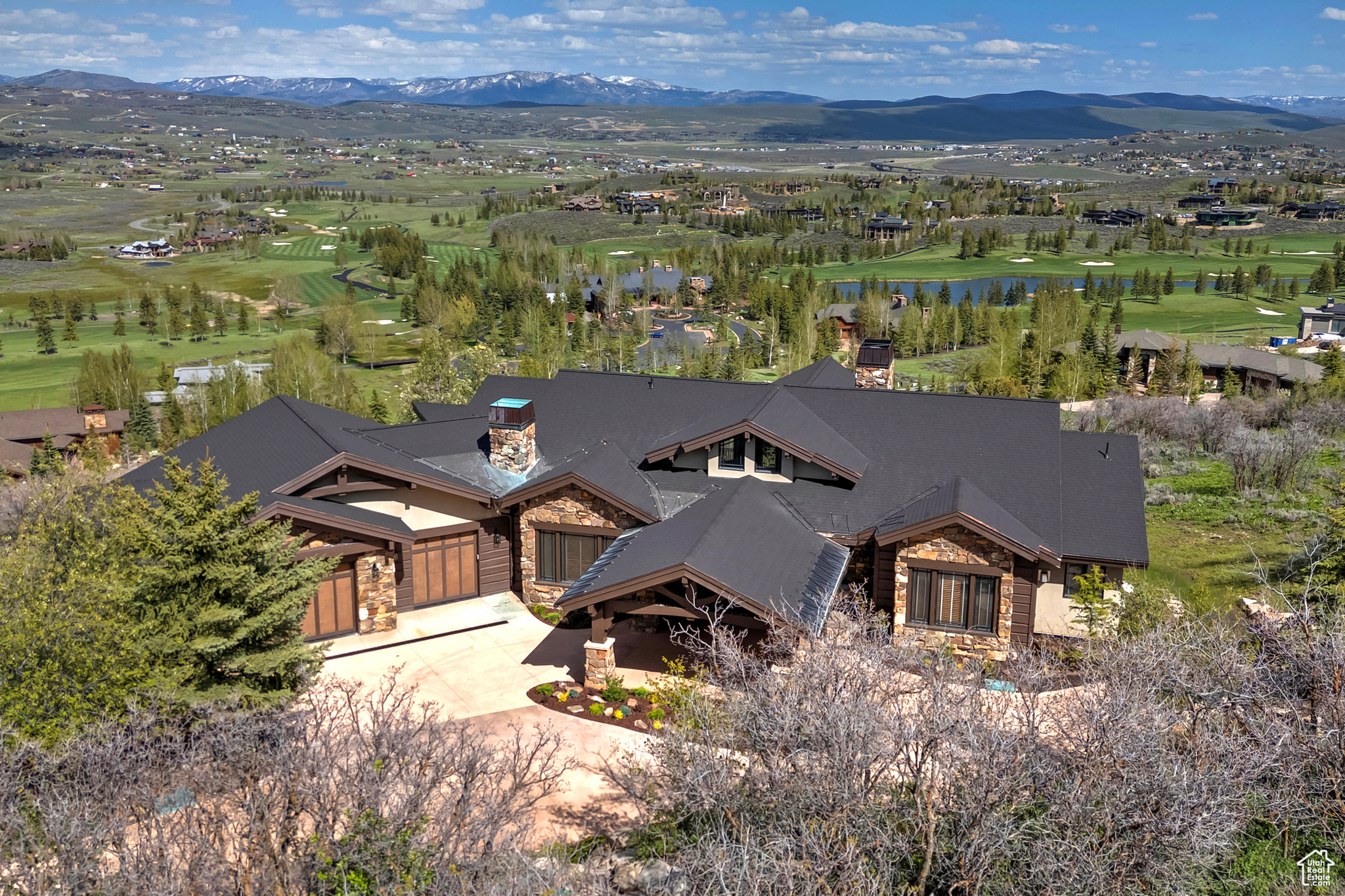 Drone Aerial View of the Golf Course, Pond & Mountains Beyond