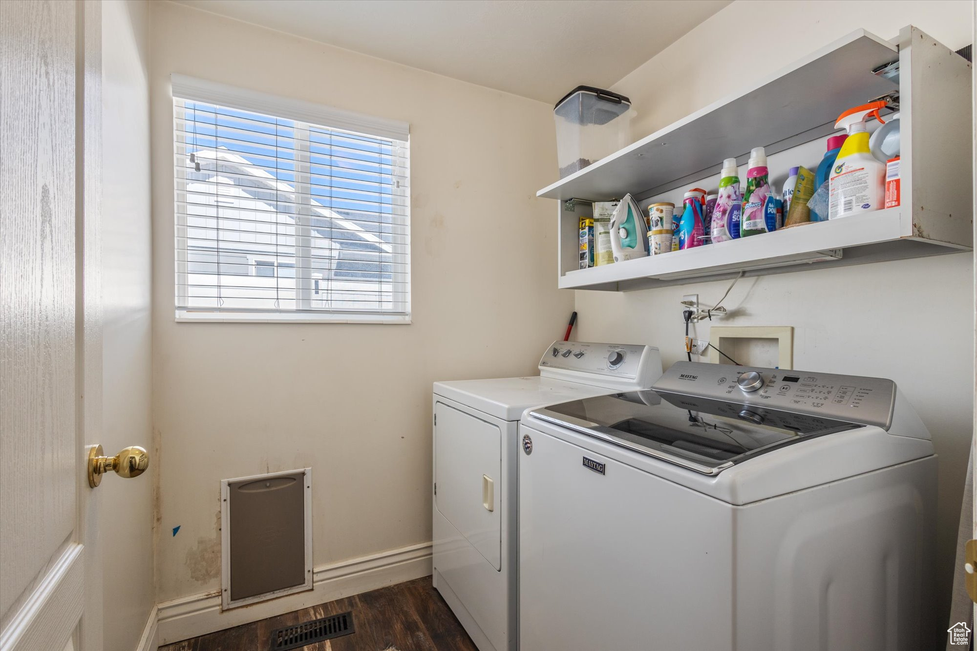 Washroom featuring washer hookup, dark hardwood / wood-style flooring, and washer and clothes dryer