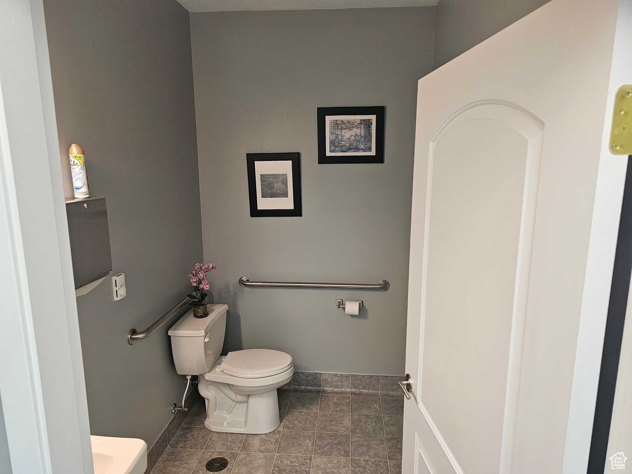 Bathroom with tile flooring and toilet