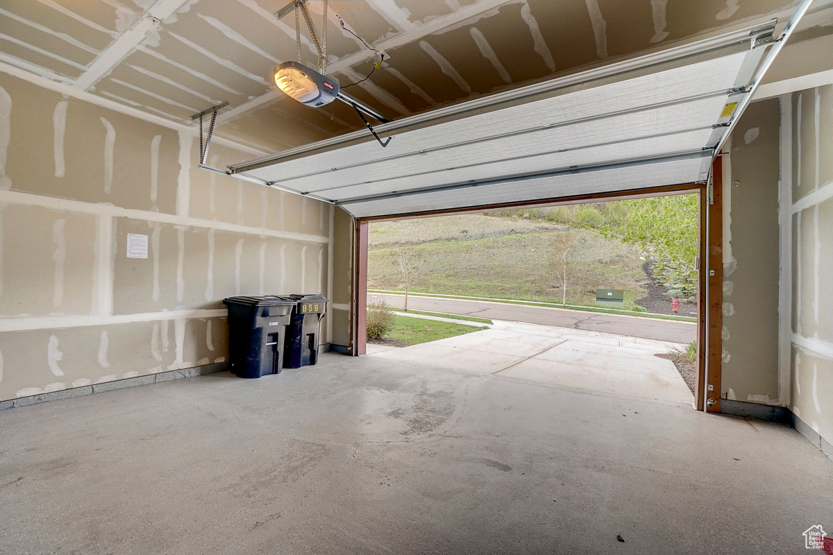 Garage featuring a garage door opener