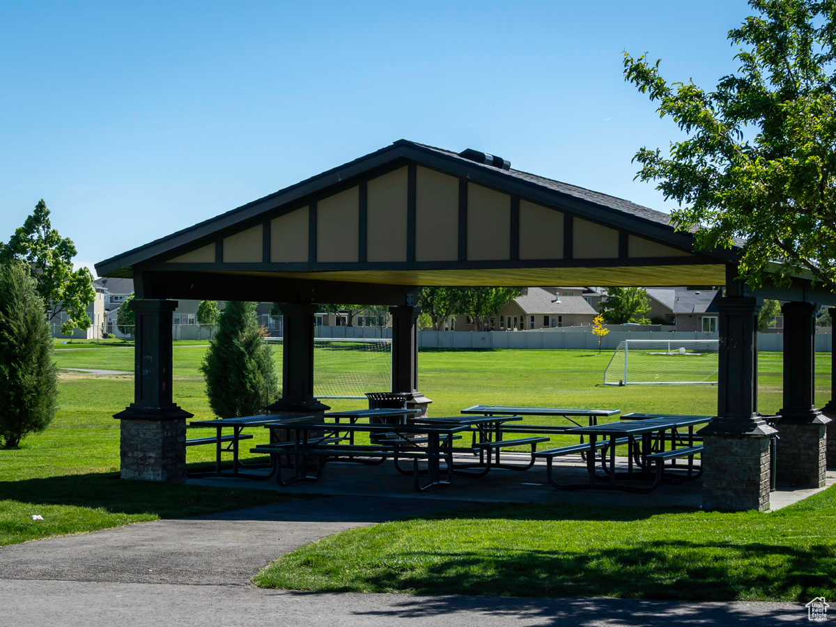 View of property's community with a yard