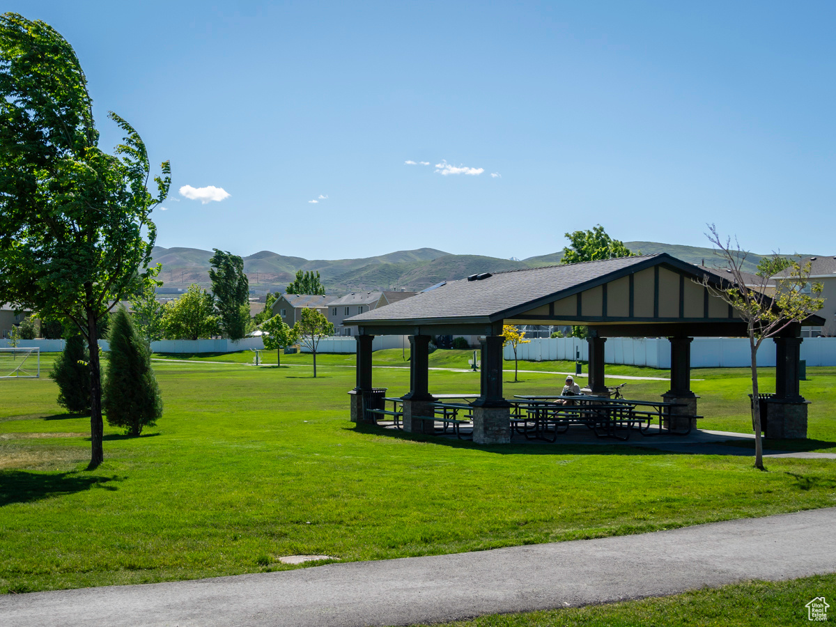 View of home's community with a yard, a gazebo, and a mountain view