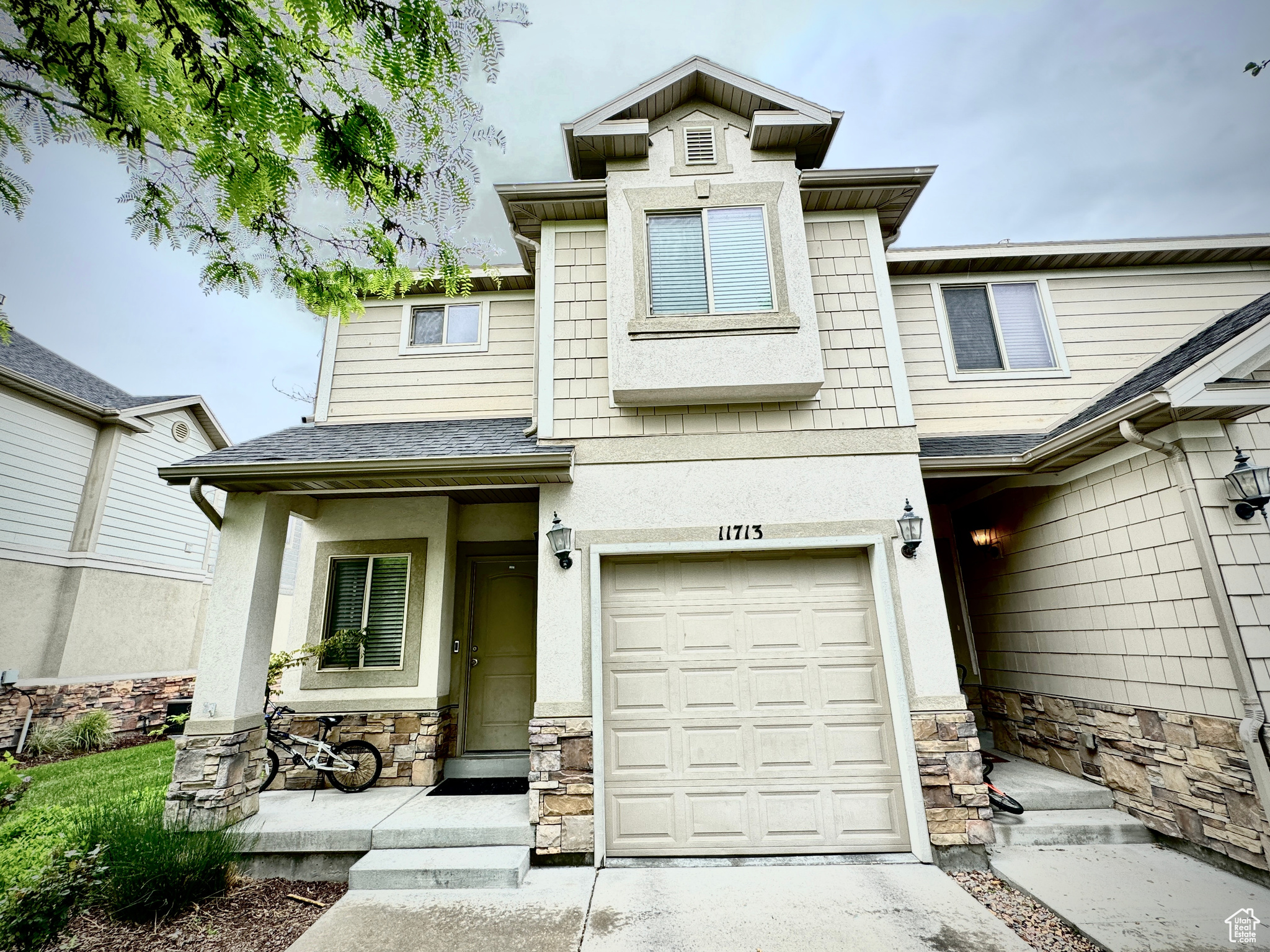 View of front of property featuring a garage