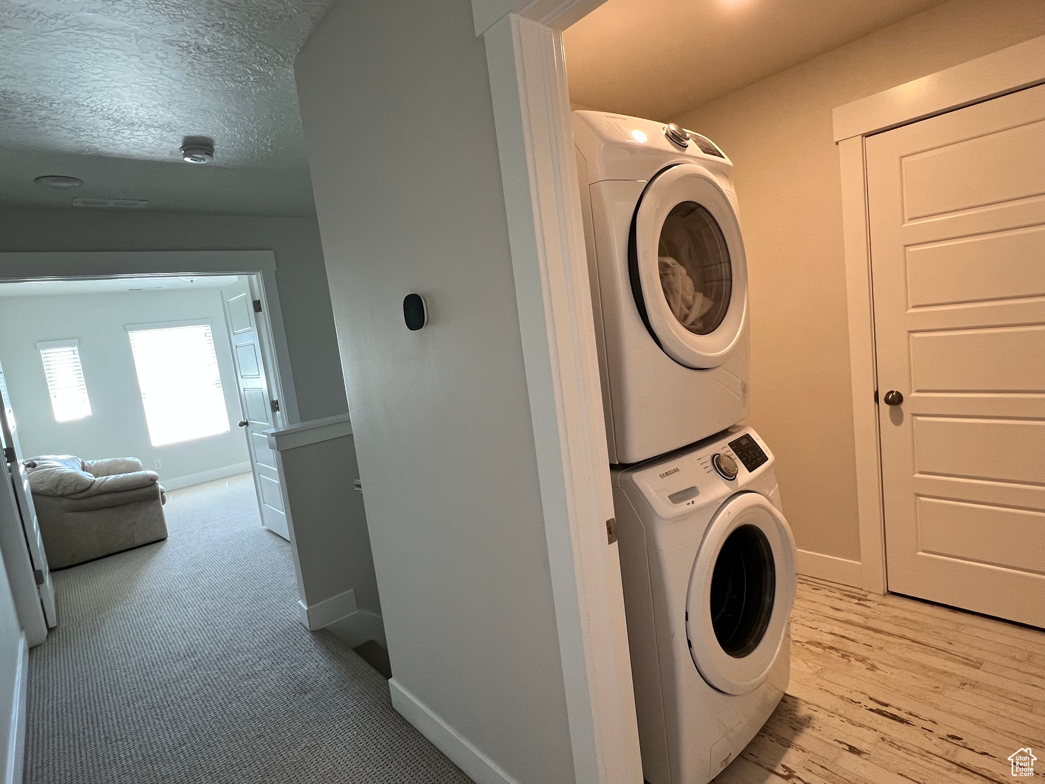 Washroom with a stacked washer / dryer