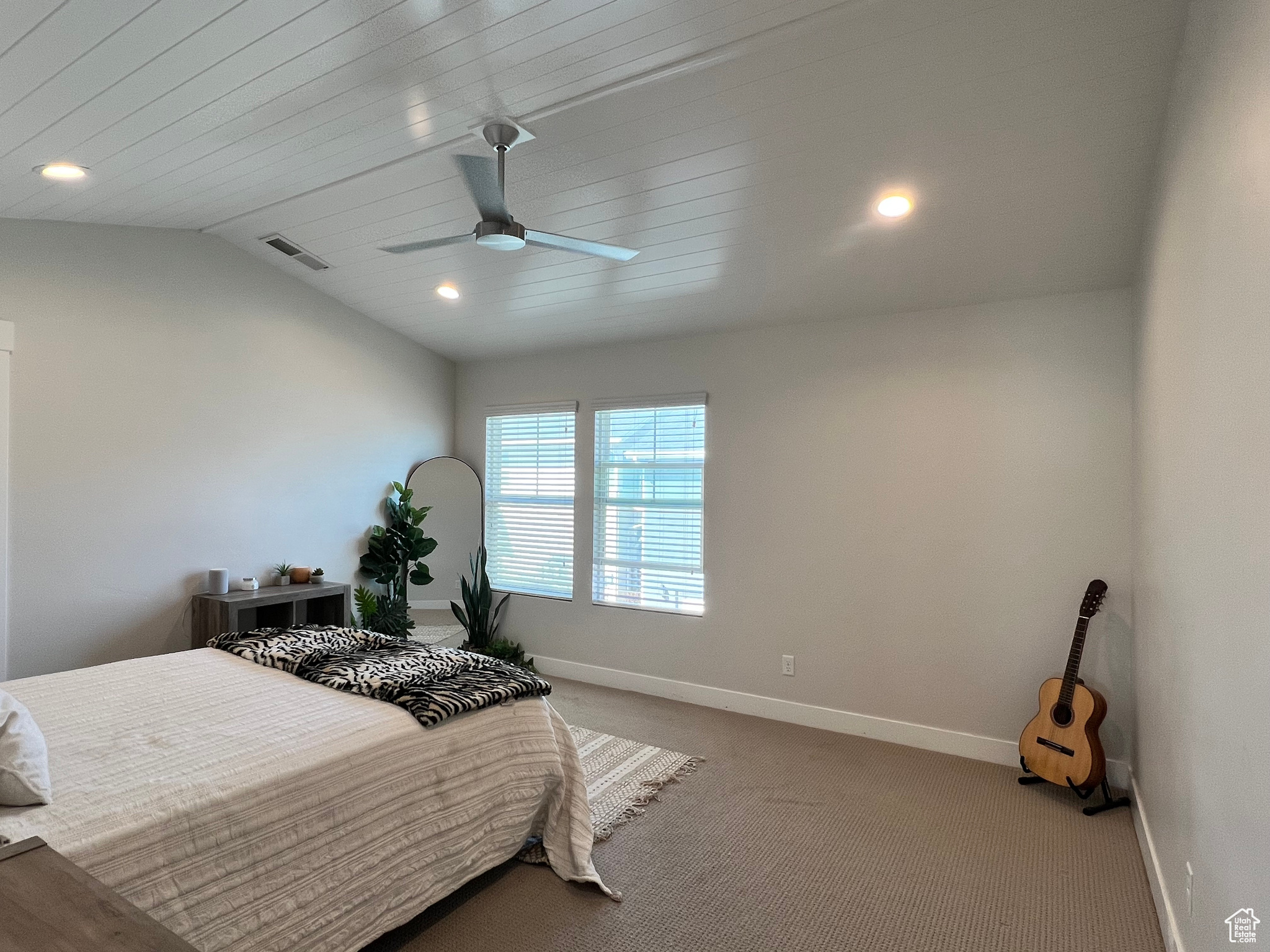 Main Bedroom with lofted ceiling, carpet, and ceiling fan