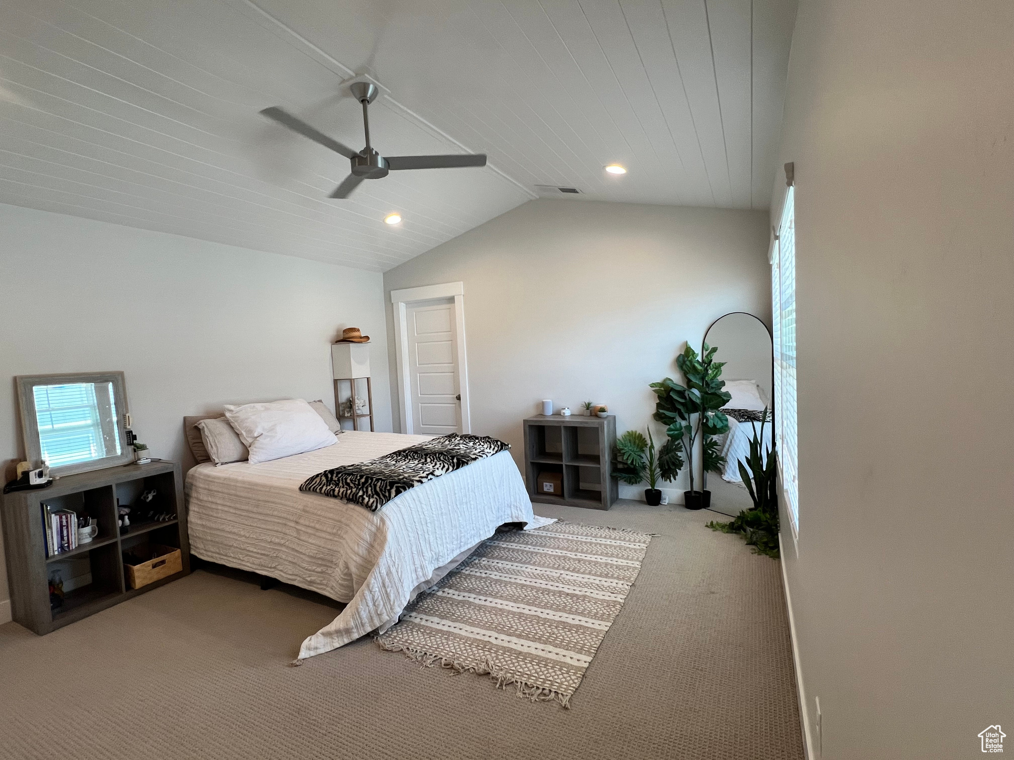 Main Bedroom featuring lofted ceiling, carpet flooring, and ceiling fan