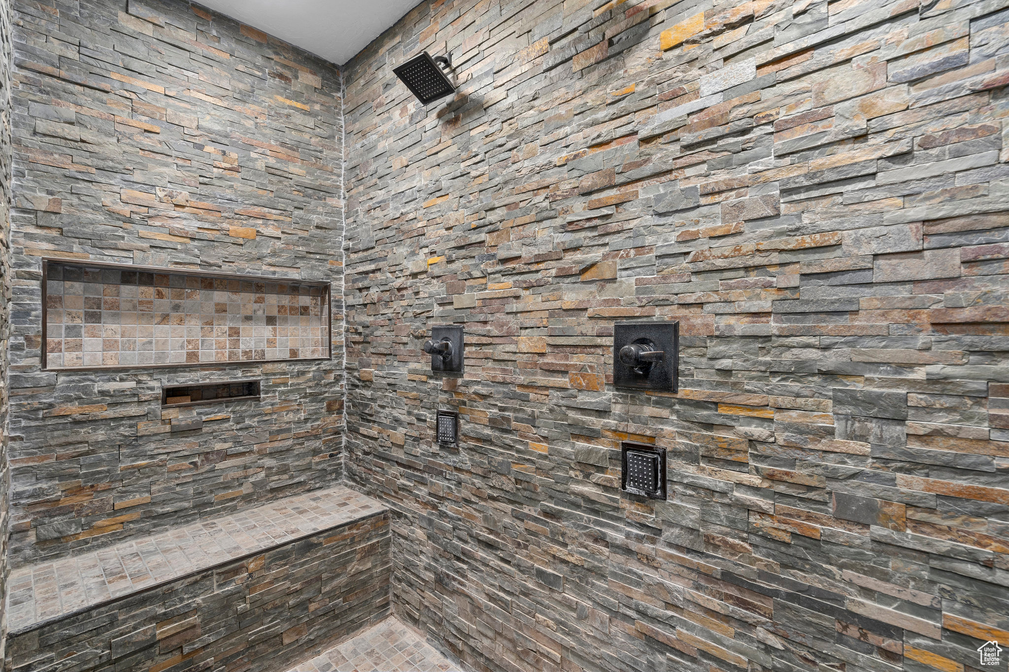 Bathroom featuring tiled shower