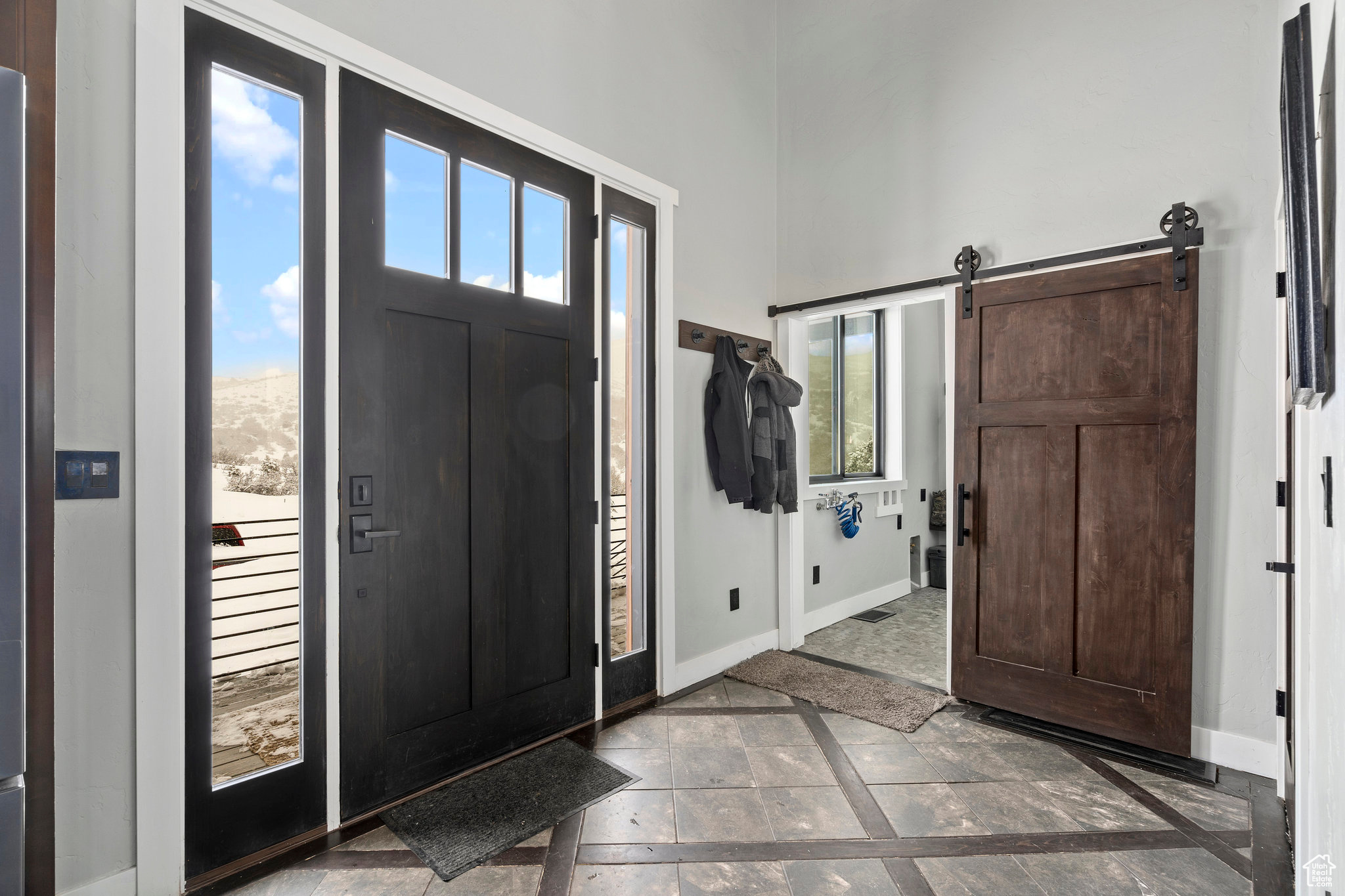 Foyer featuring a barn door