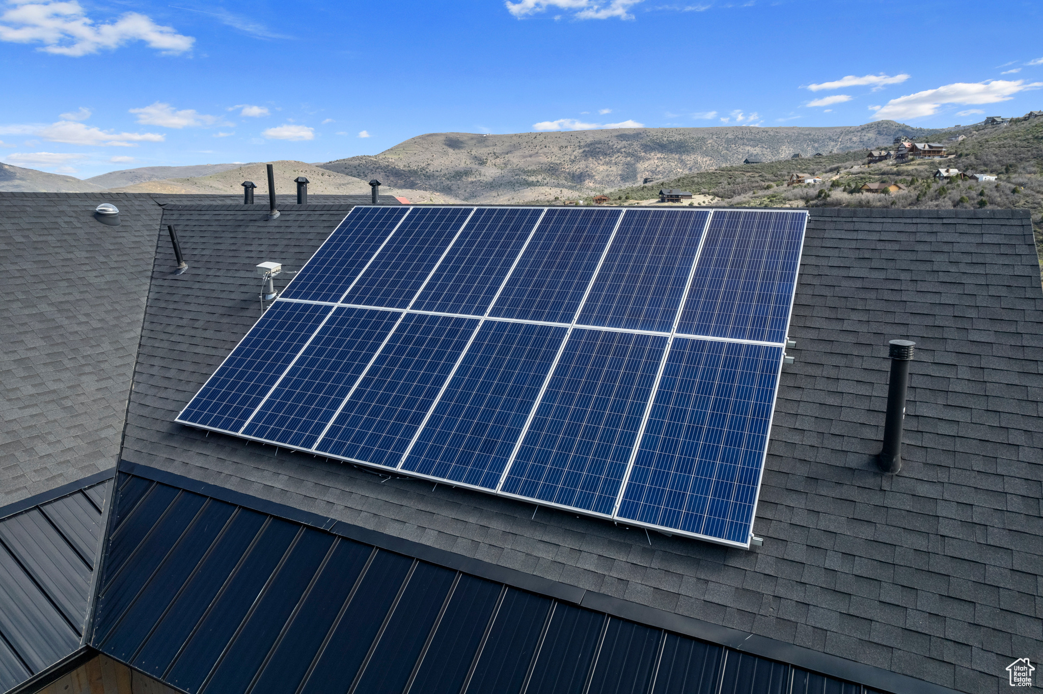 Exterior space with a mountain view and solar panels